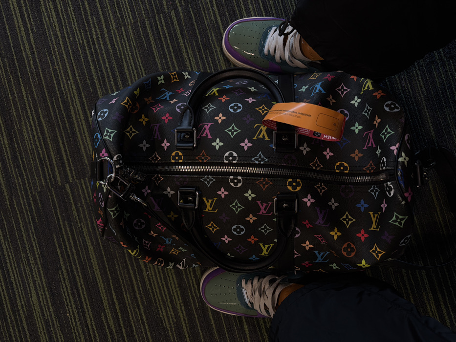 Person seated on carpet at Istanbul Airport