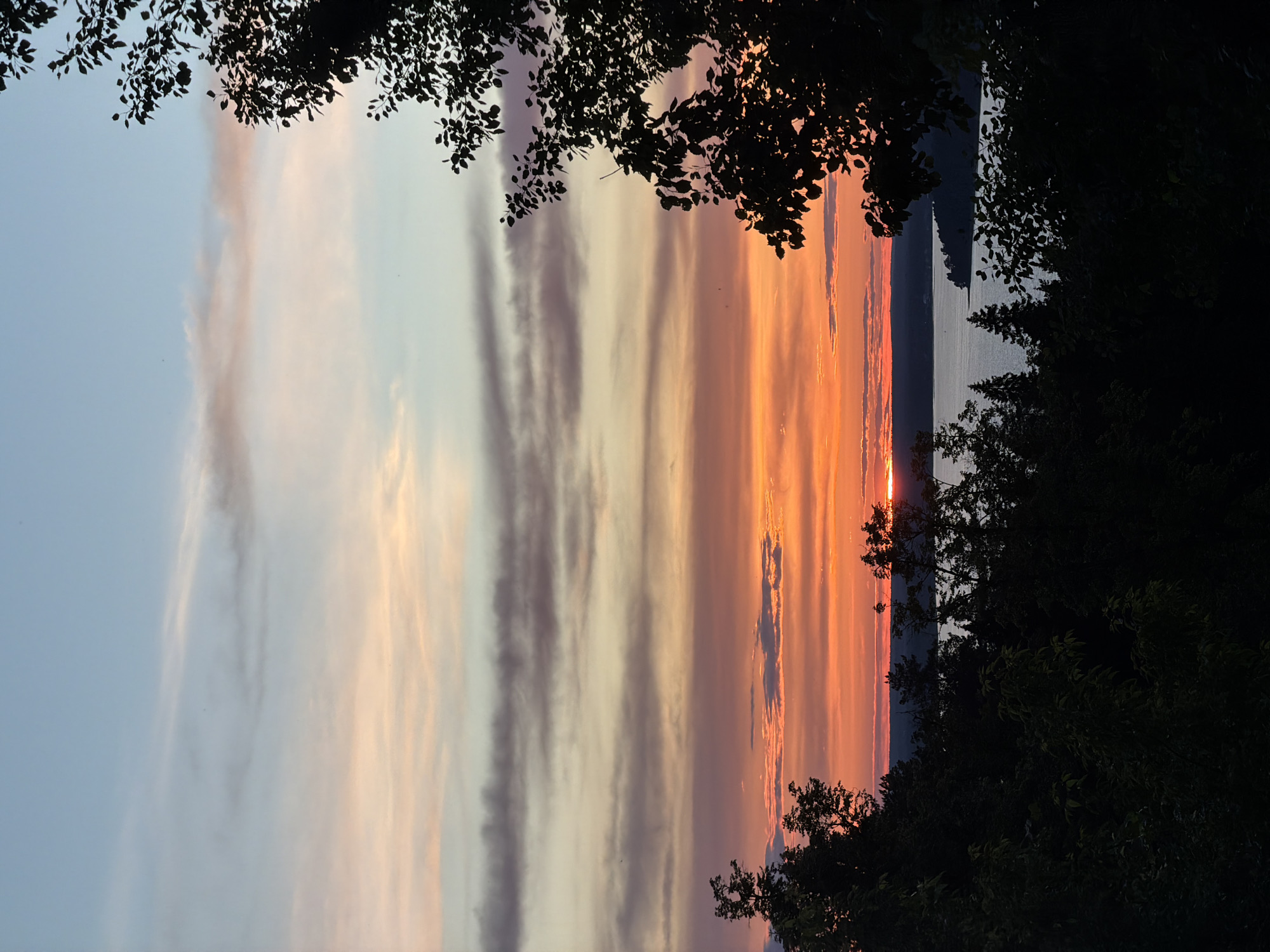Sunset documented over water in Izhevsk, Russia