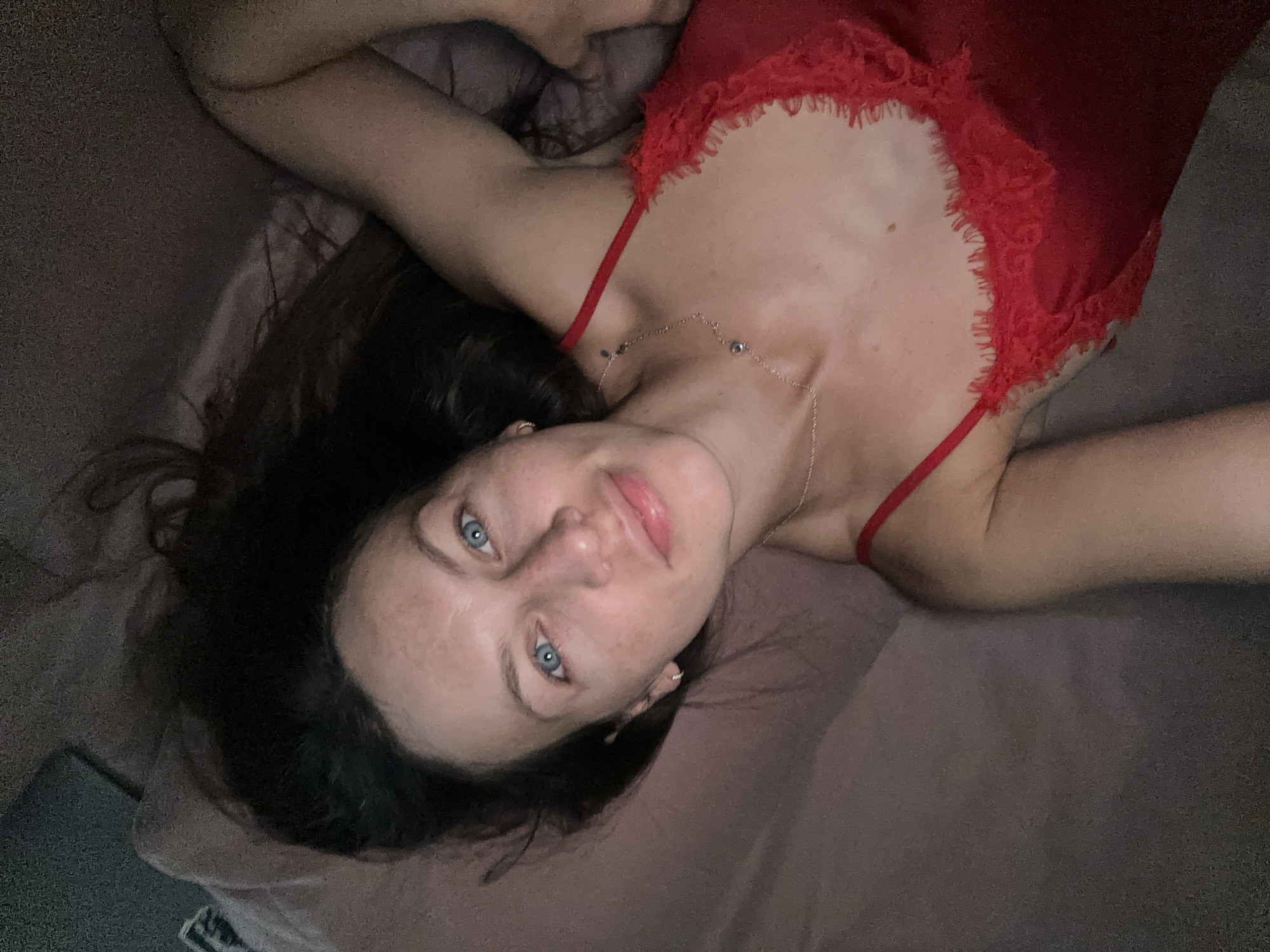 Personal photo session in a Montenegro room, red lace outfit