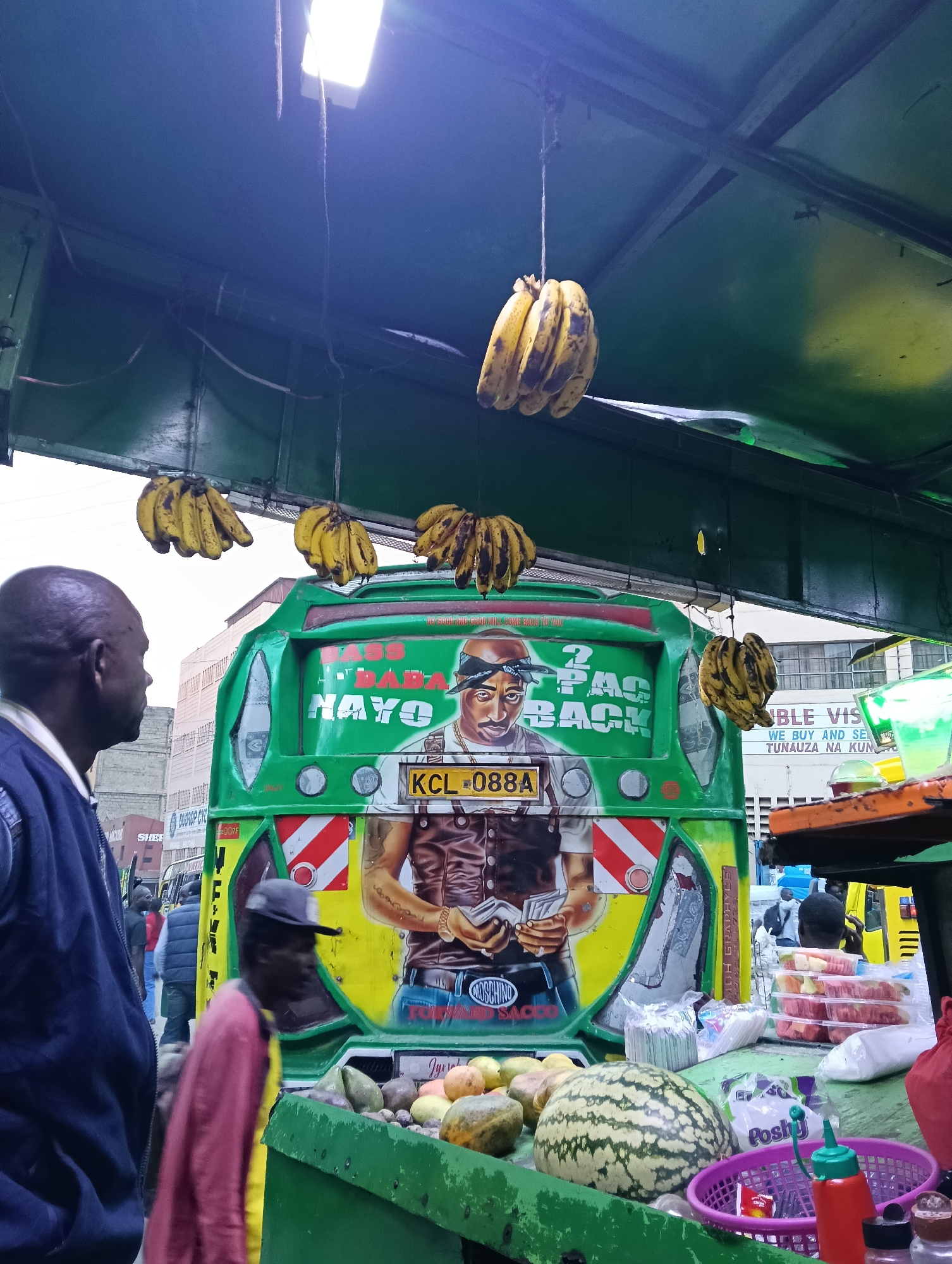 Vibrant matatu spotted at busy Nairobi street market