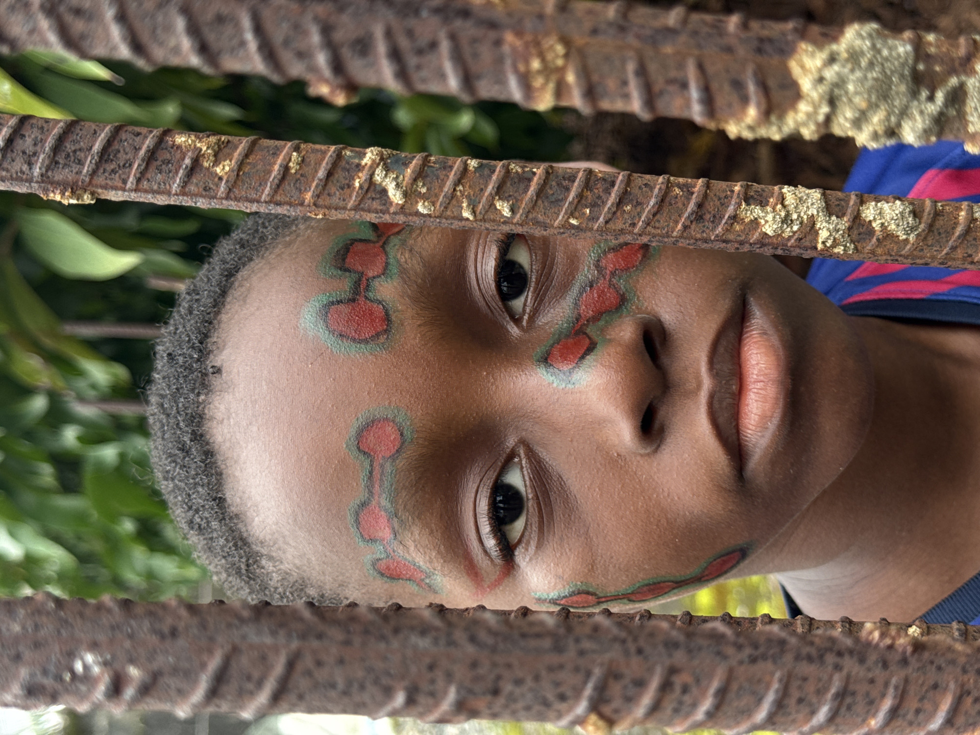 Kids in bold face paint, Ado Nigeria — a superstitions theme