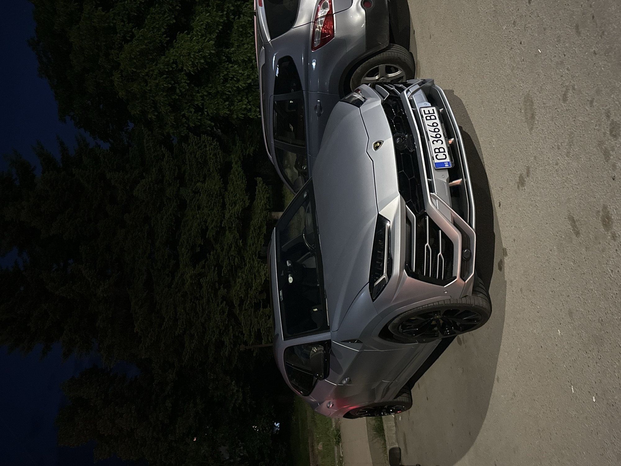 Gray Lamborghini, Nissan parked on Veliko Tarnovo street