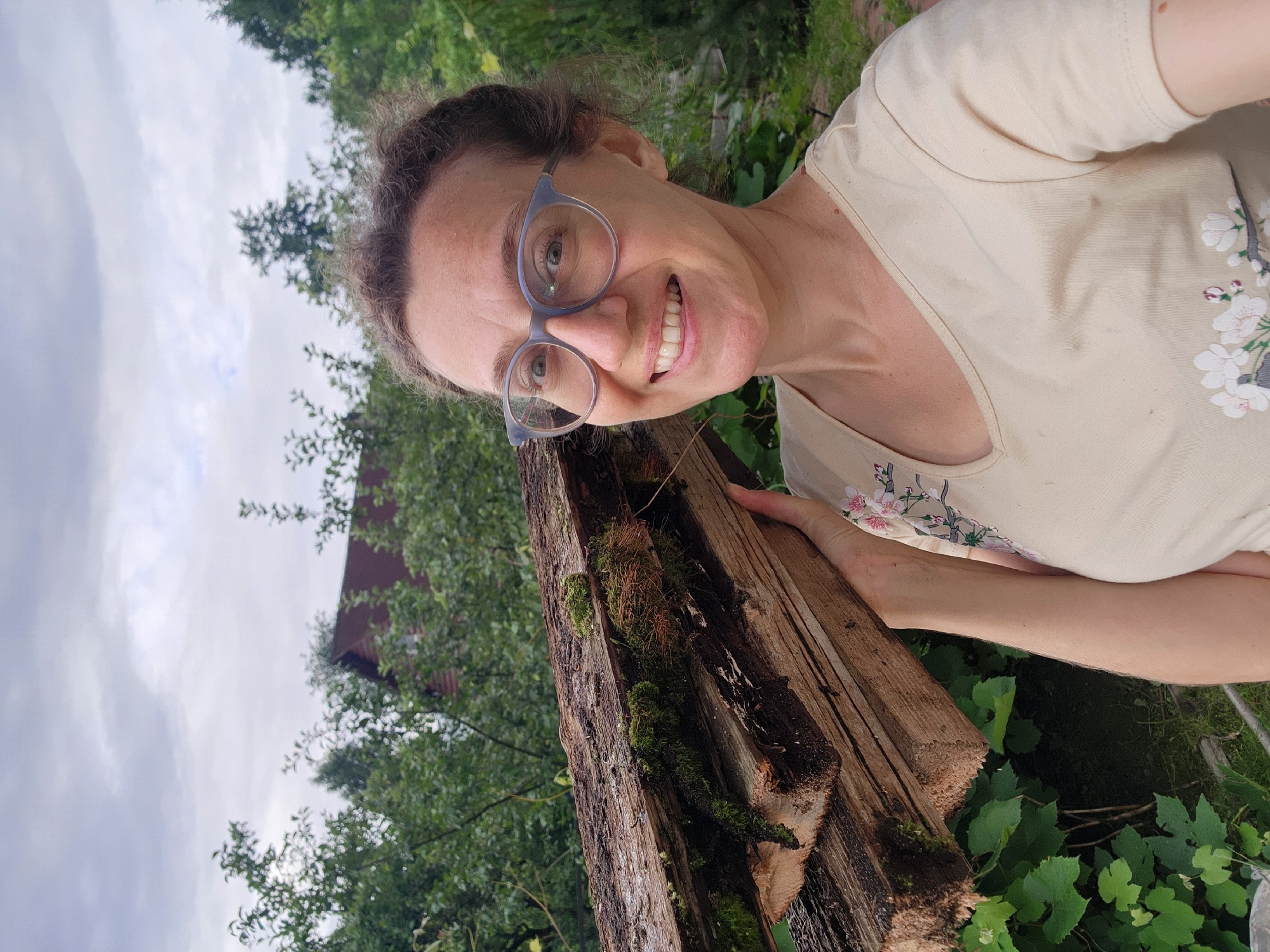 Garden check-in: roses, squash, firewood, and a silly face