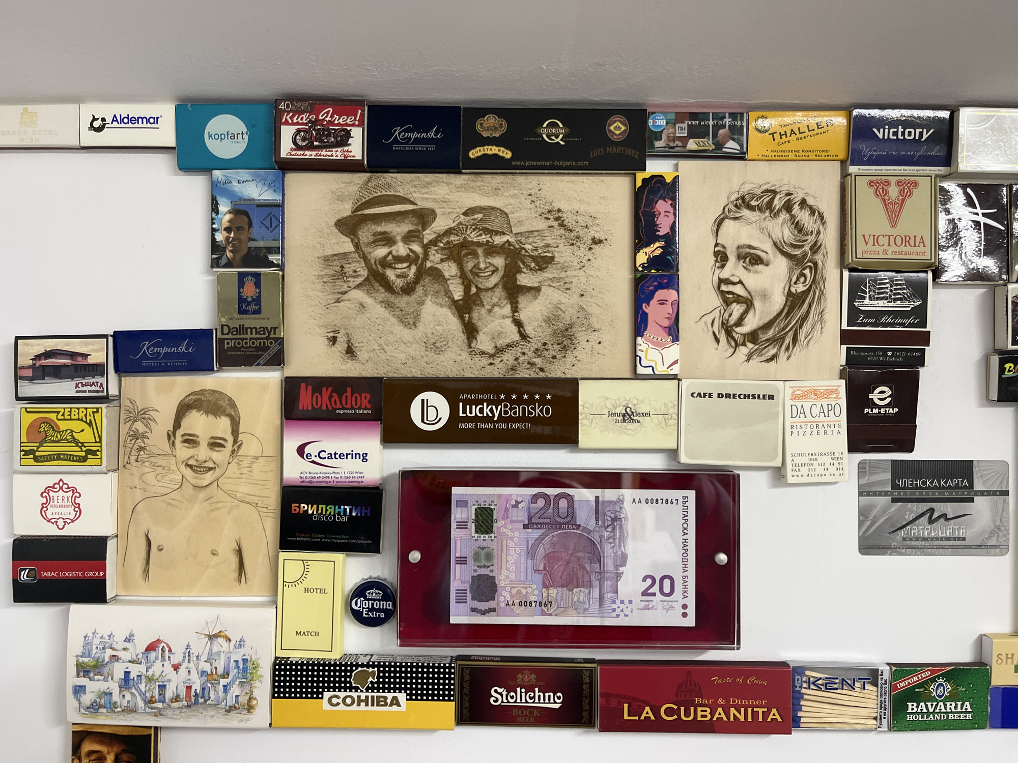 Matchbox and memorabilia collection displayed on wall in Bulgaria