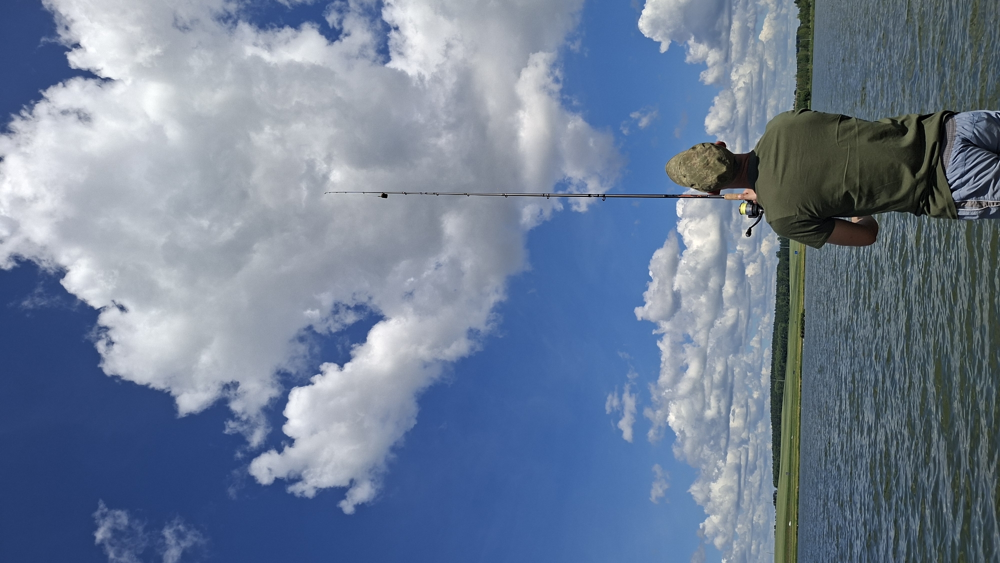 Lazy summer fishing day at a Smalyavichy lakeside