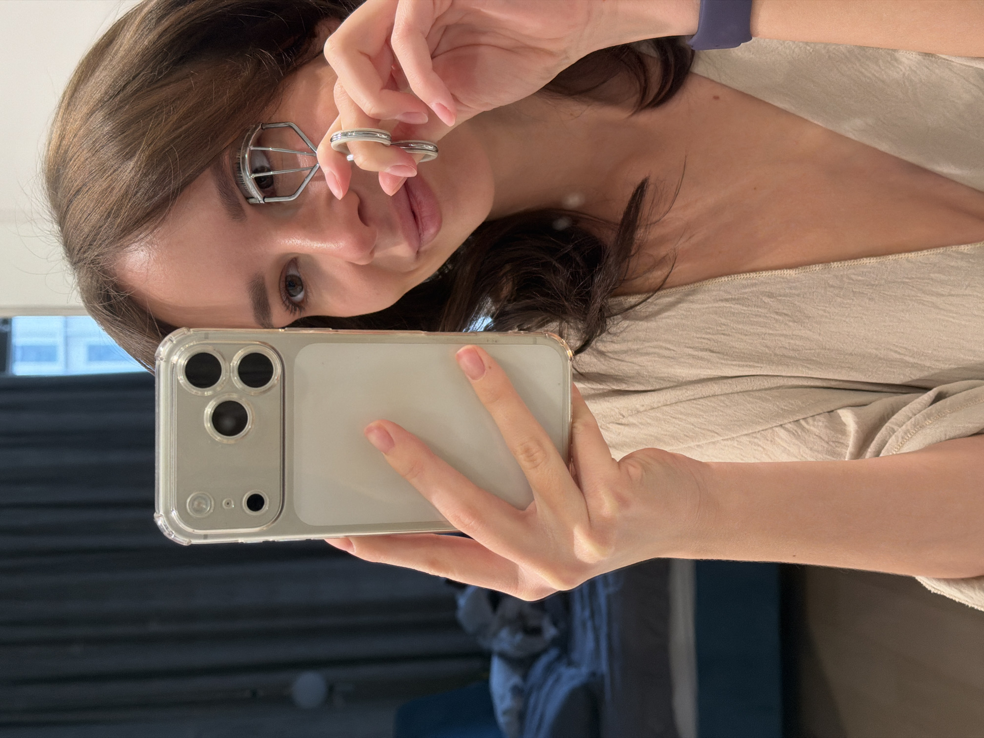 Woman Takes Selfie While Using Eyelash Curler in Moscow