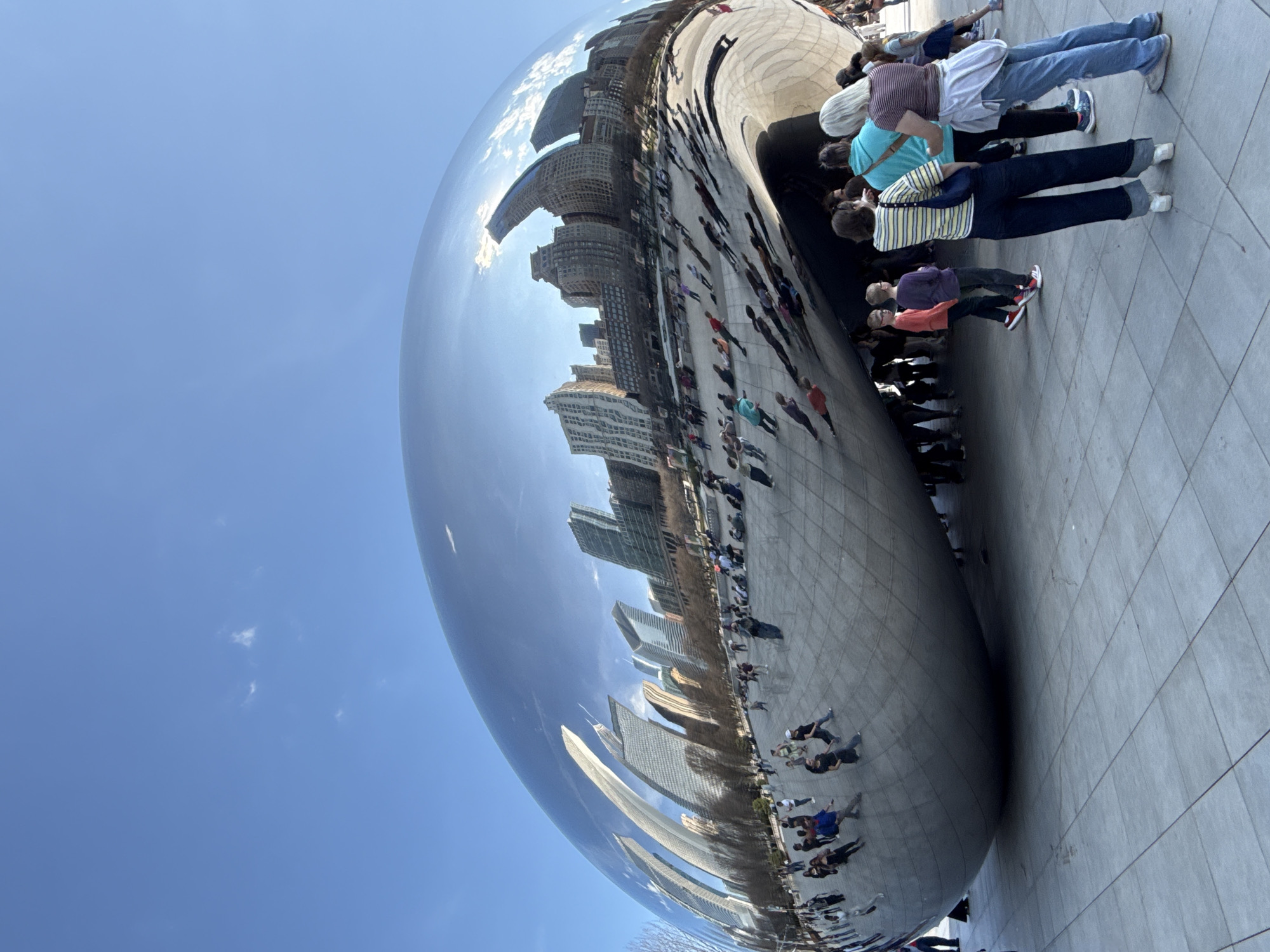 Visitors gather at Chicago's Cloud Gate sculpture in Millennium Park