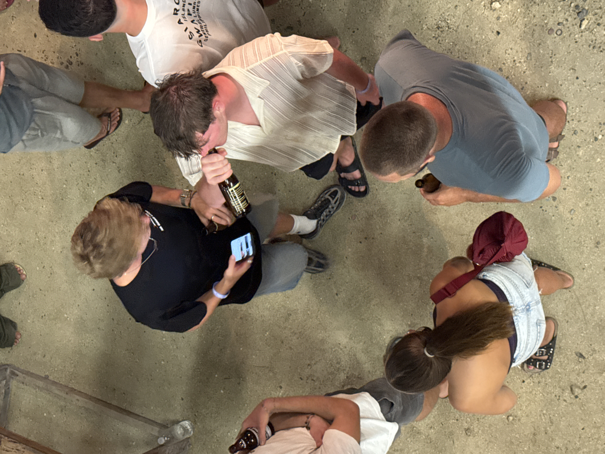 Young adults gather for outdoor drinking games in General Luna
