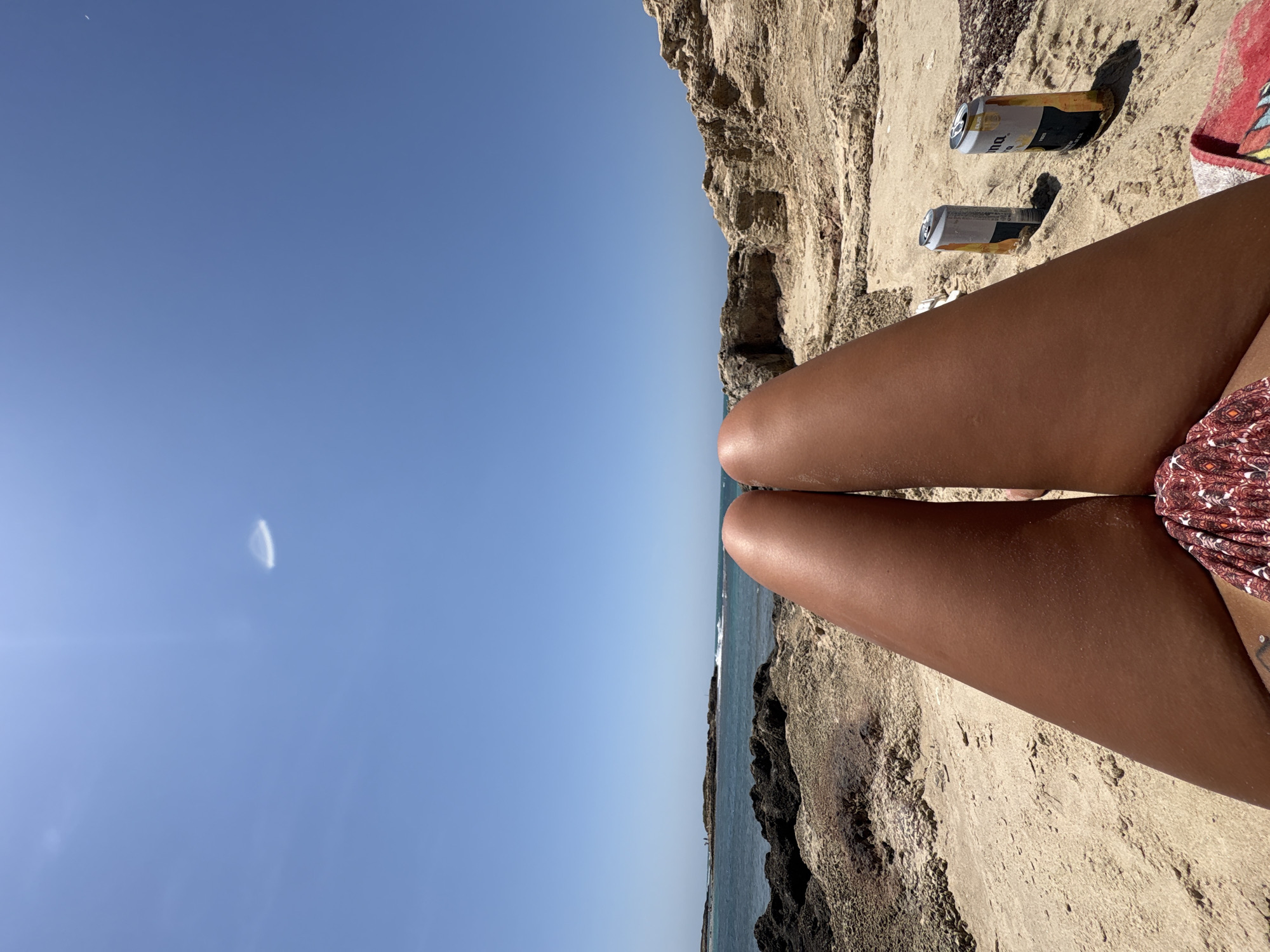 Beachgoer enjoys sunny day at Hof HaCarmel coast