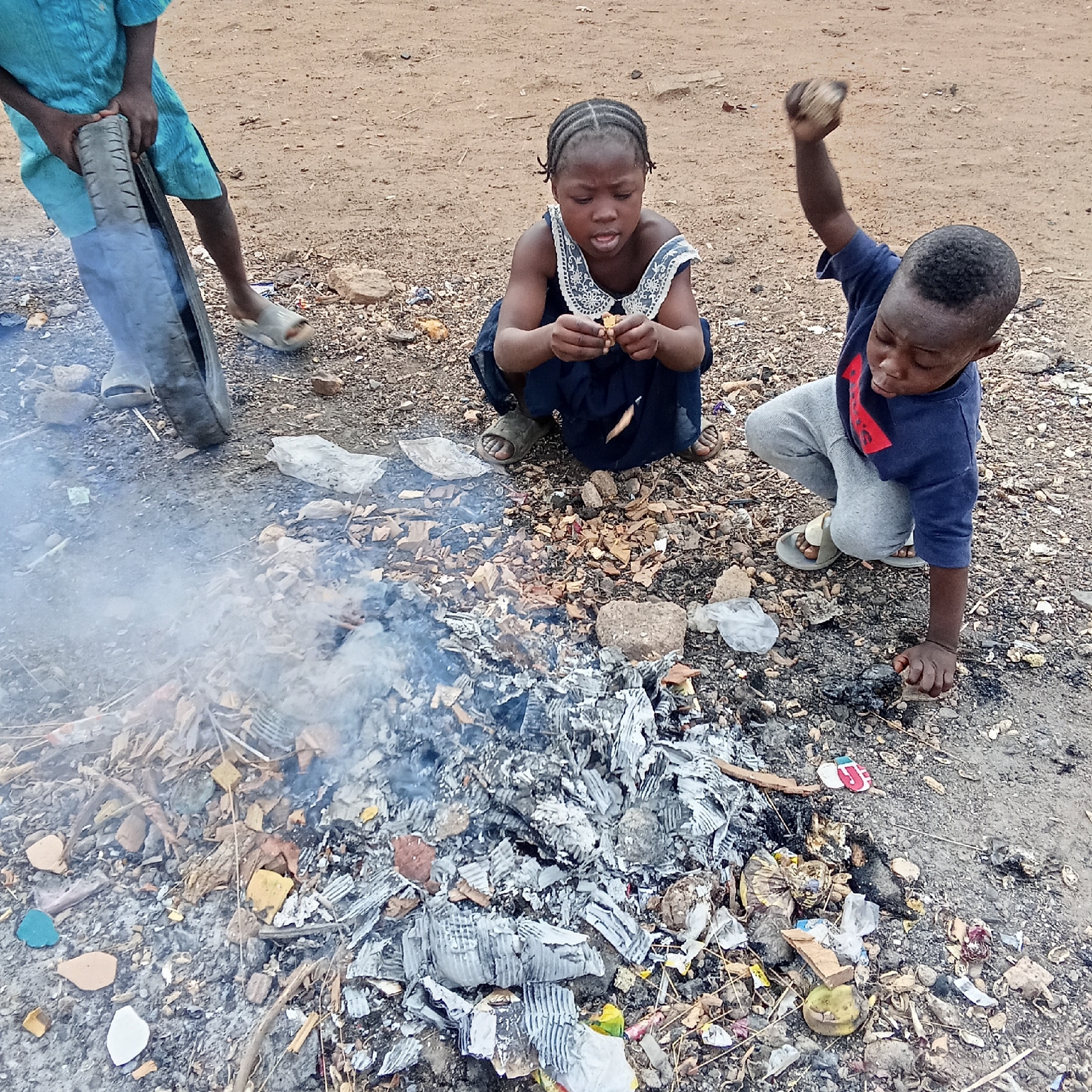 Morning life captured in Akwanga: children playing, mother nursing