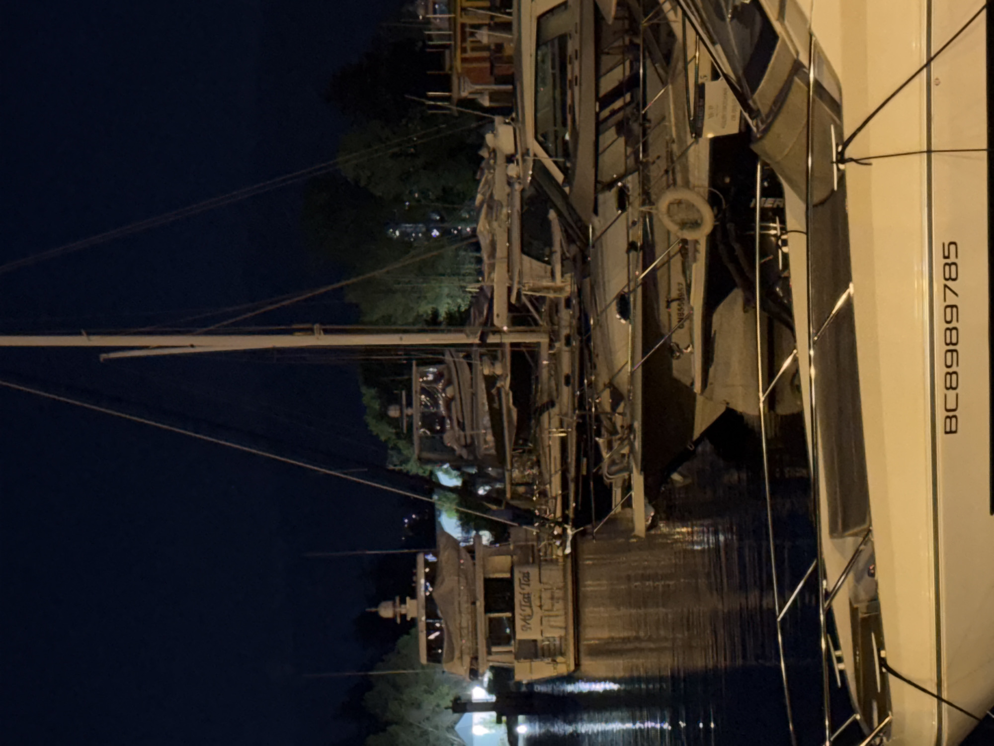 Vancouver marina nighttime scenes documented with luxury boats, vehicles