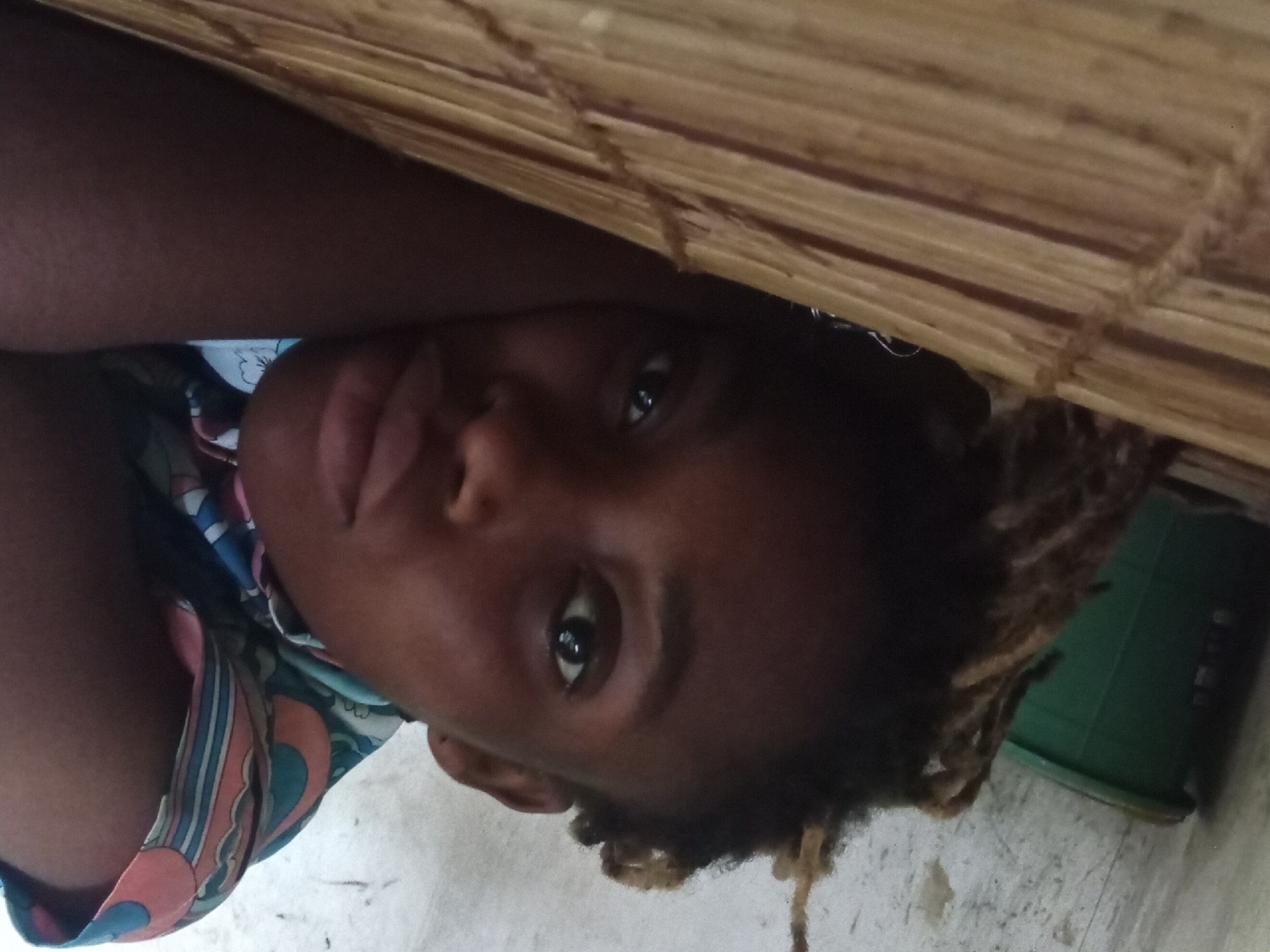 Person with dreadlocks captured in indoor casual moments