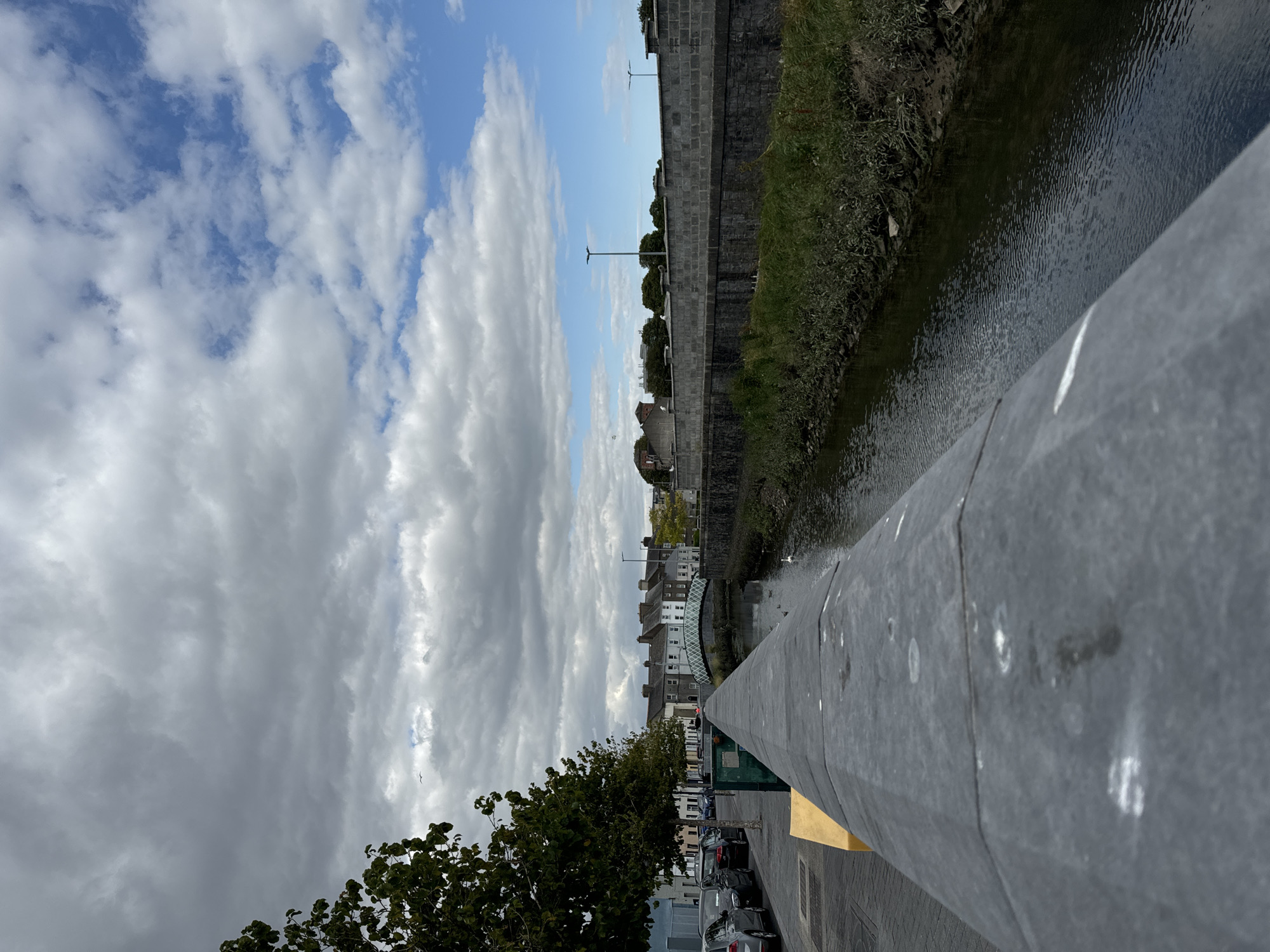 Waterford streets, riverbanks, and bare interiors on a cloudy July afternoon