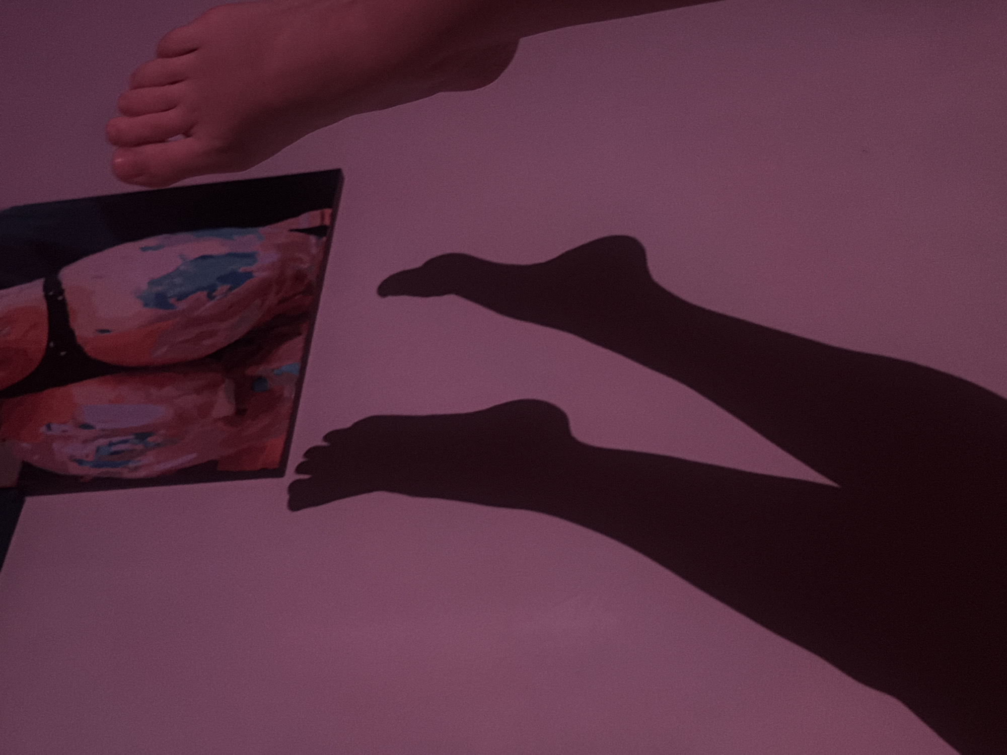 Person photographed in bedroom setting in Moscow