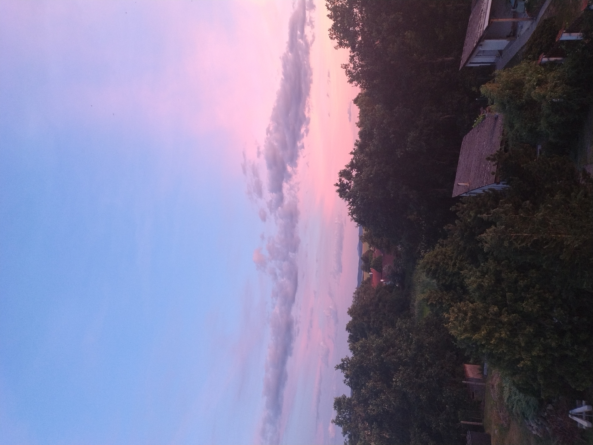 Summer sunset over the rural outskirts of Dobev, Czechia