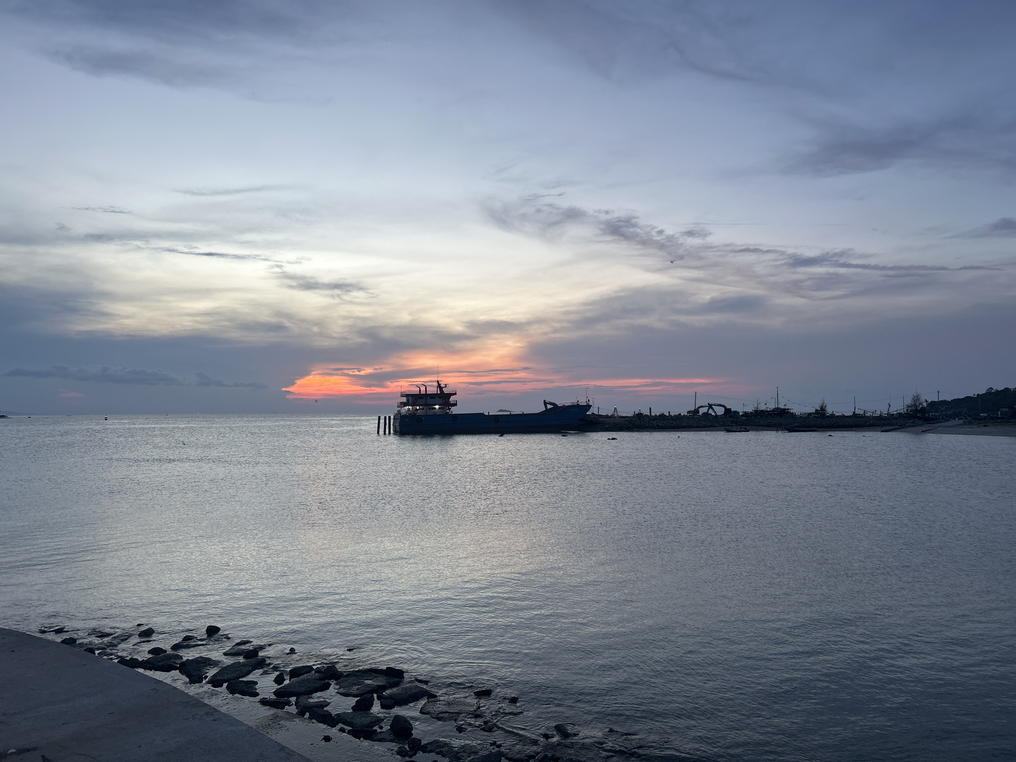 Sunset gathering documented at Thong Sala pier, Thailand