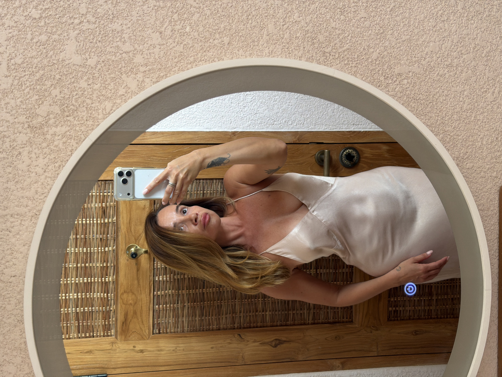 Mirror selfie in a Mengwi room, champagne slip dress