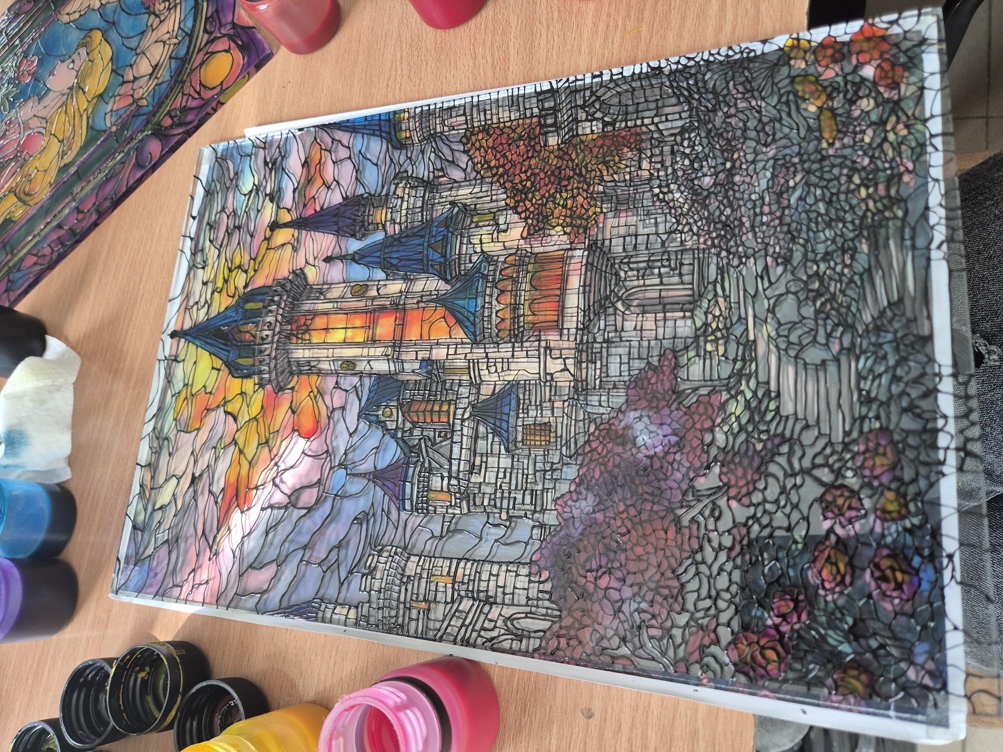 Artist creates stained-glass artwork in Bulgarian studio workspace
