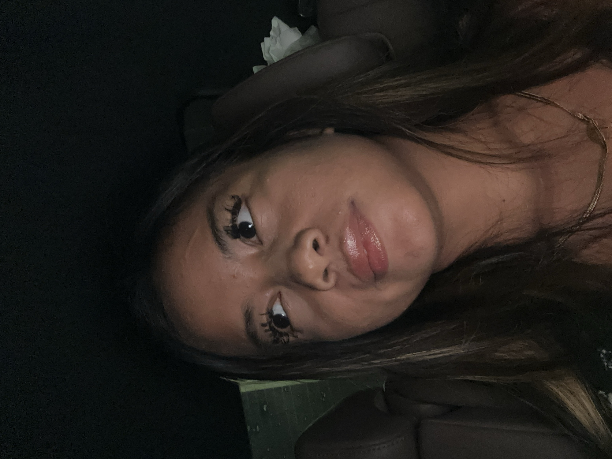 Woman photographed in car passenger seat in South Jakarta