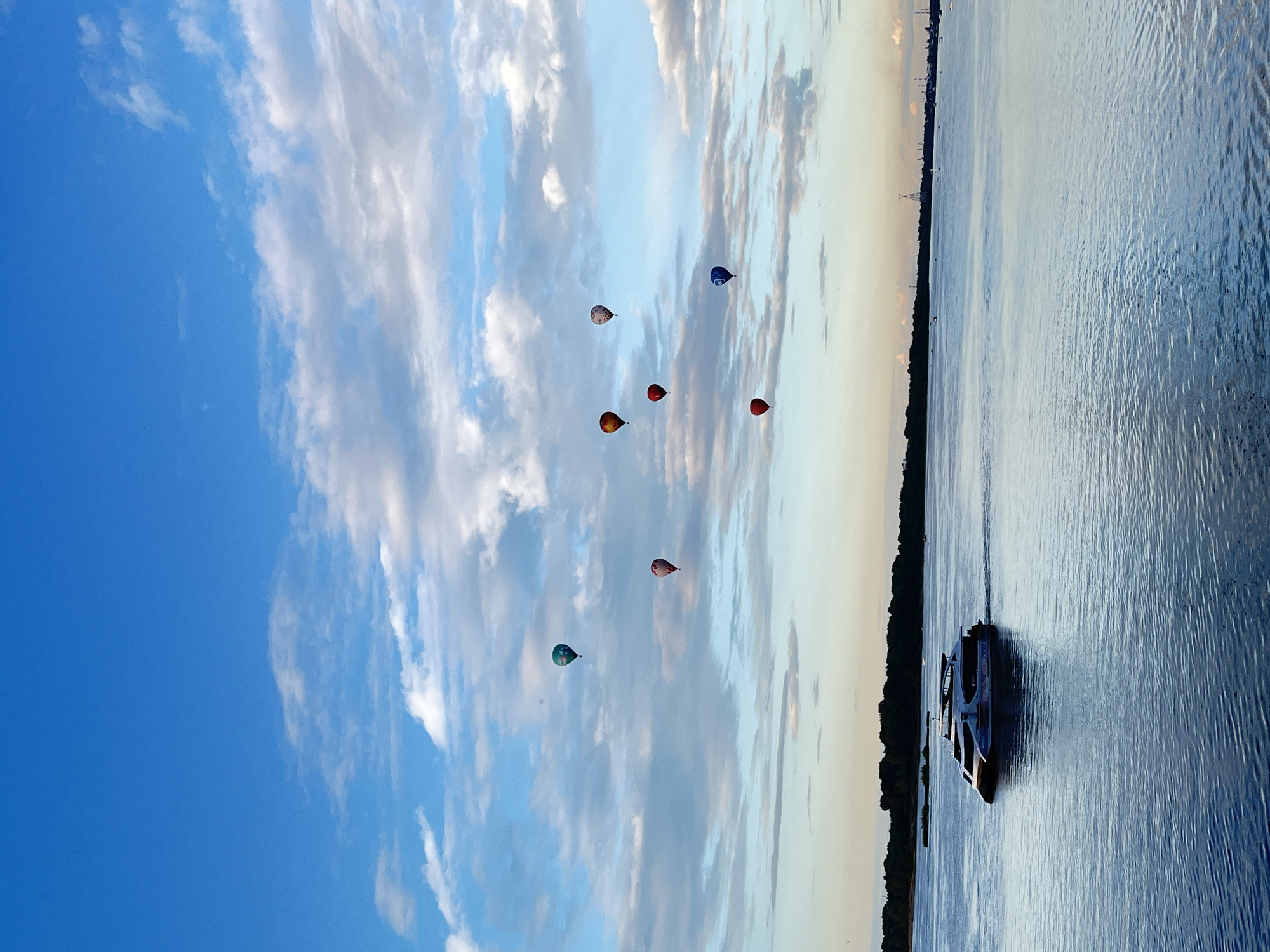 Hot air balloons float above the Volga River in Nizhny Novgorod