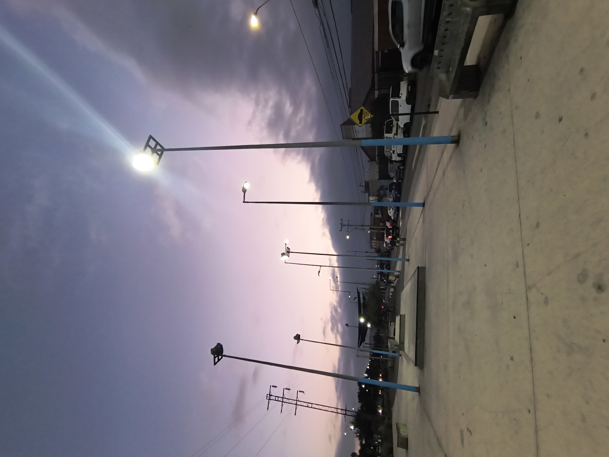 Evening street documentation and car repair in Arica, Chile