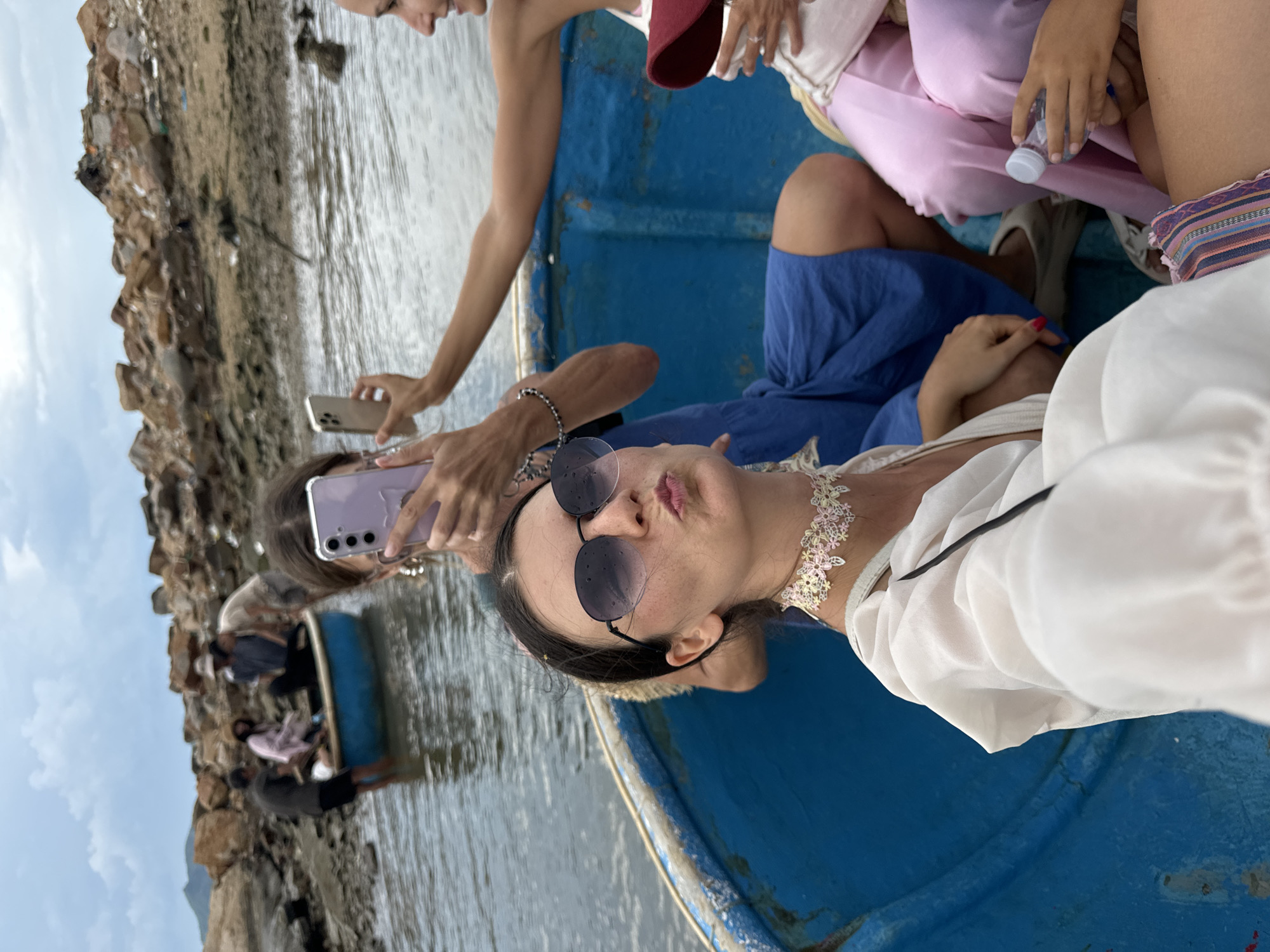 Coracle boat rides along Nha Trang's rocky harbor shore