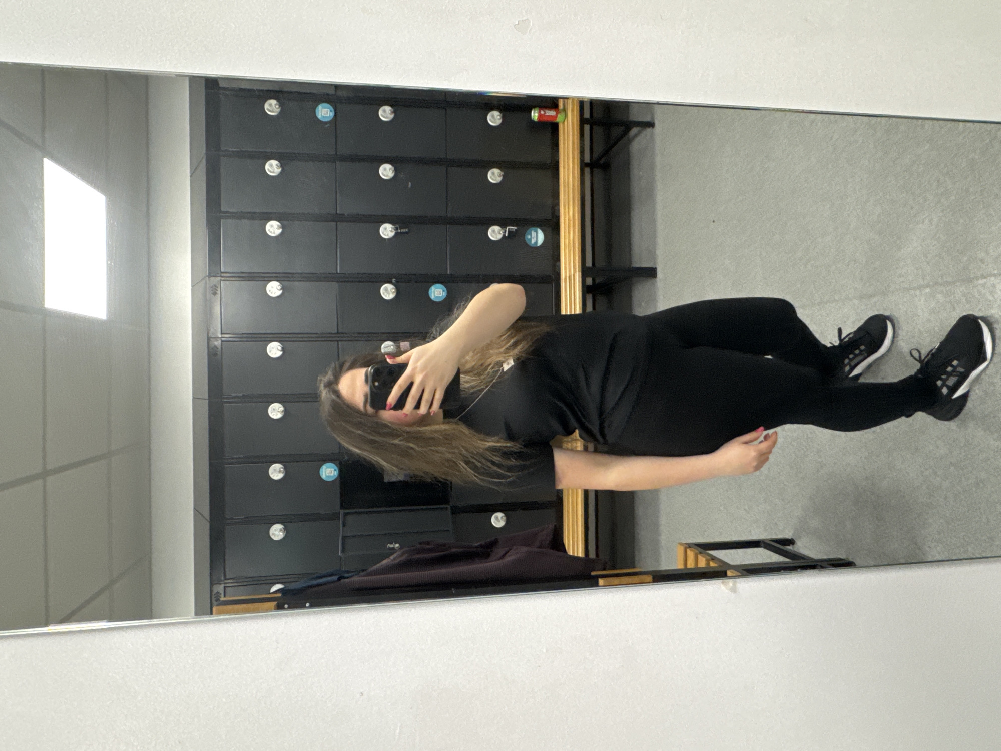 Woman takes mirror selfie in Chester locker room