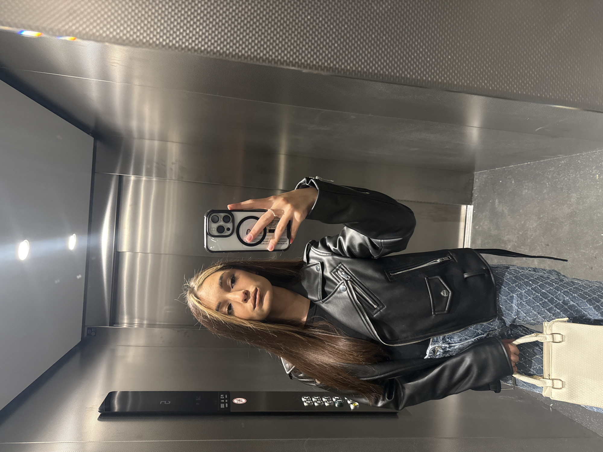 Woman Takes Mirror Selfie in Krefeld Elevator