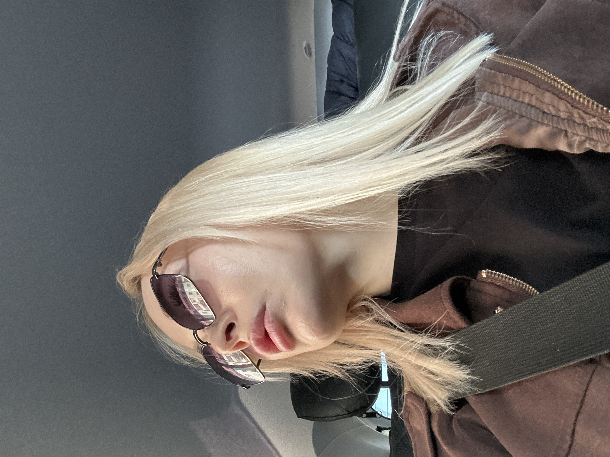 Woman in sunglasses photographed in vehicle, Megion Russia