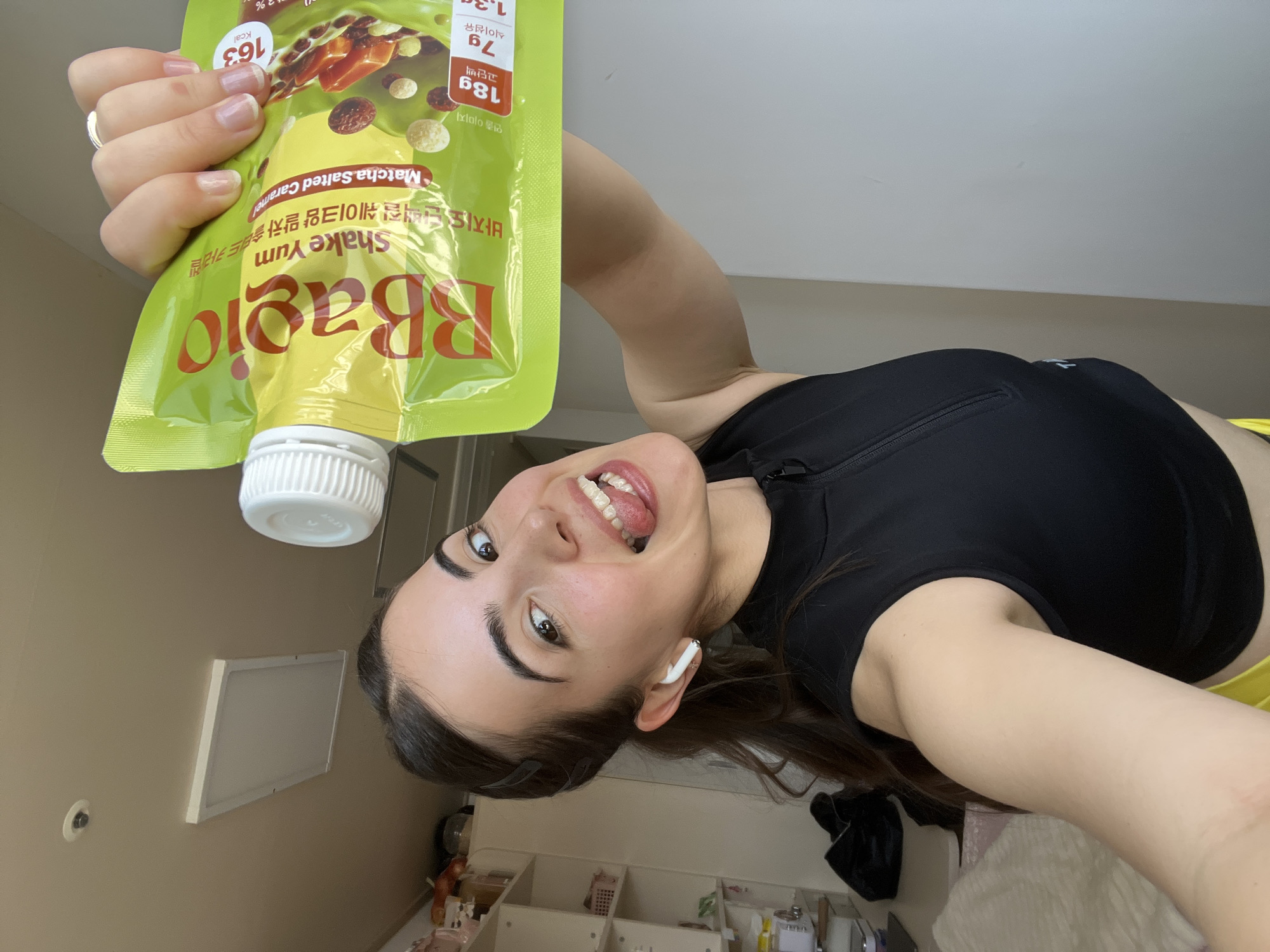 Woman displays protein shake products in Daegu morning photos