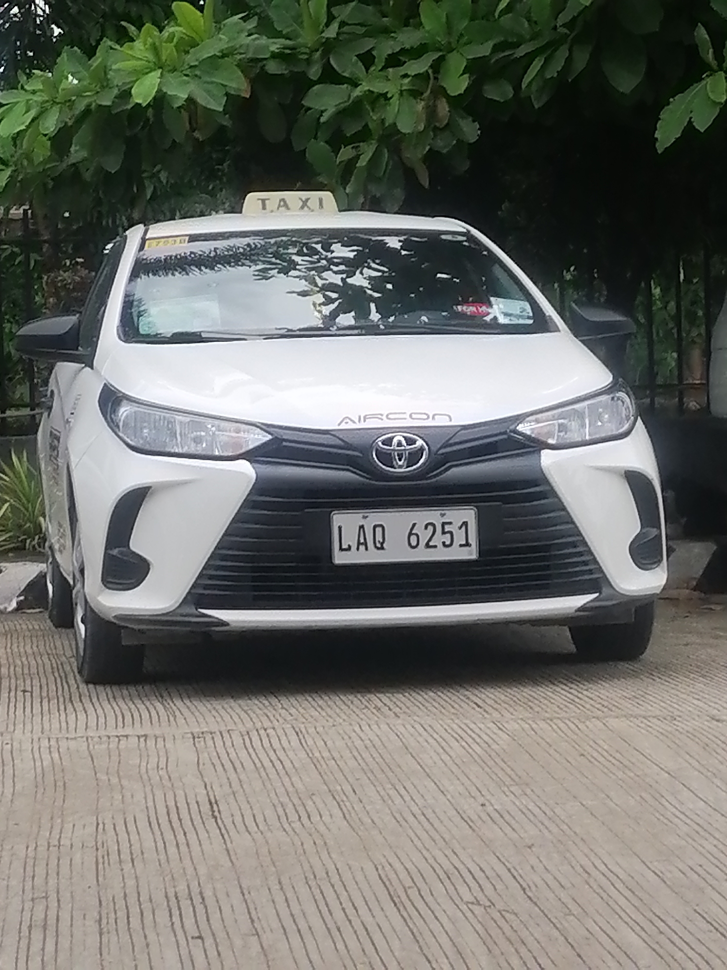 White taxi parked at LTFRB office in Davao City