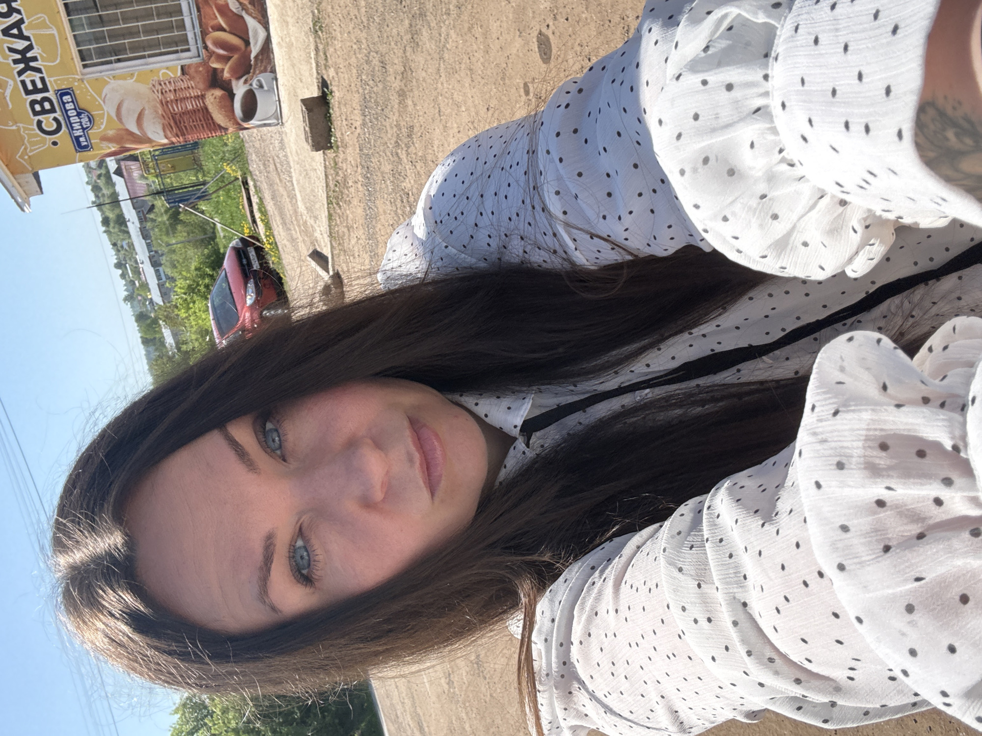 Woman takes outdoor selfies in Фоки, Russia