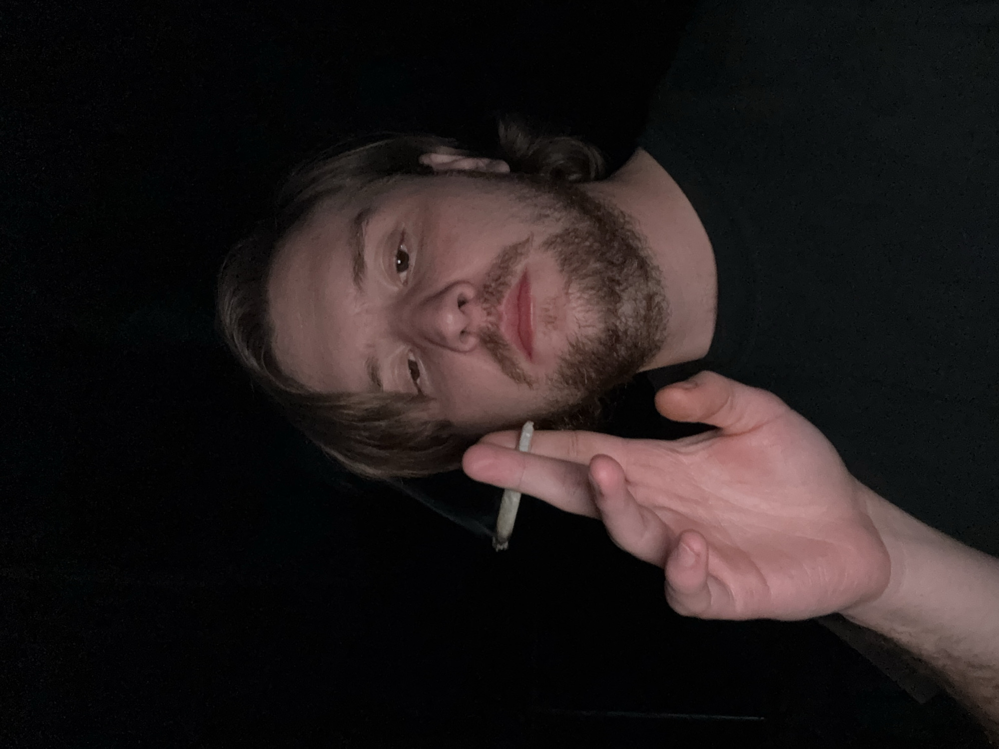 Man smoking cigarette indoors in Mexico early morning