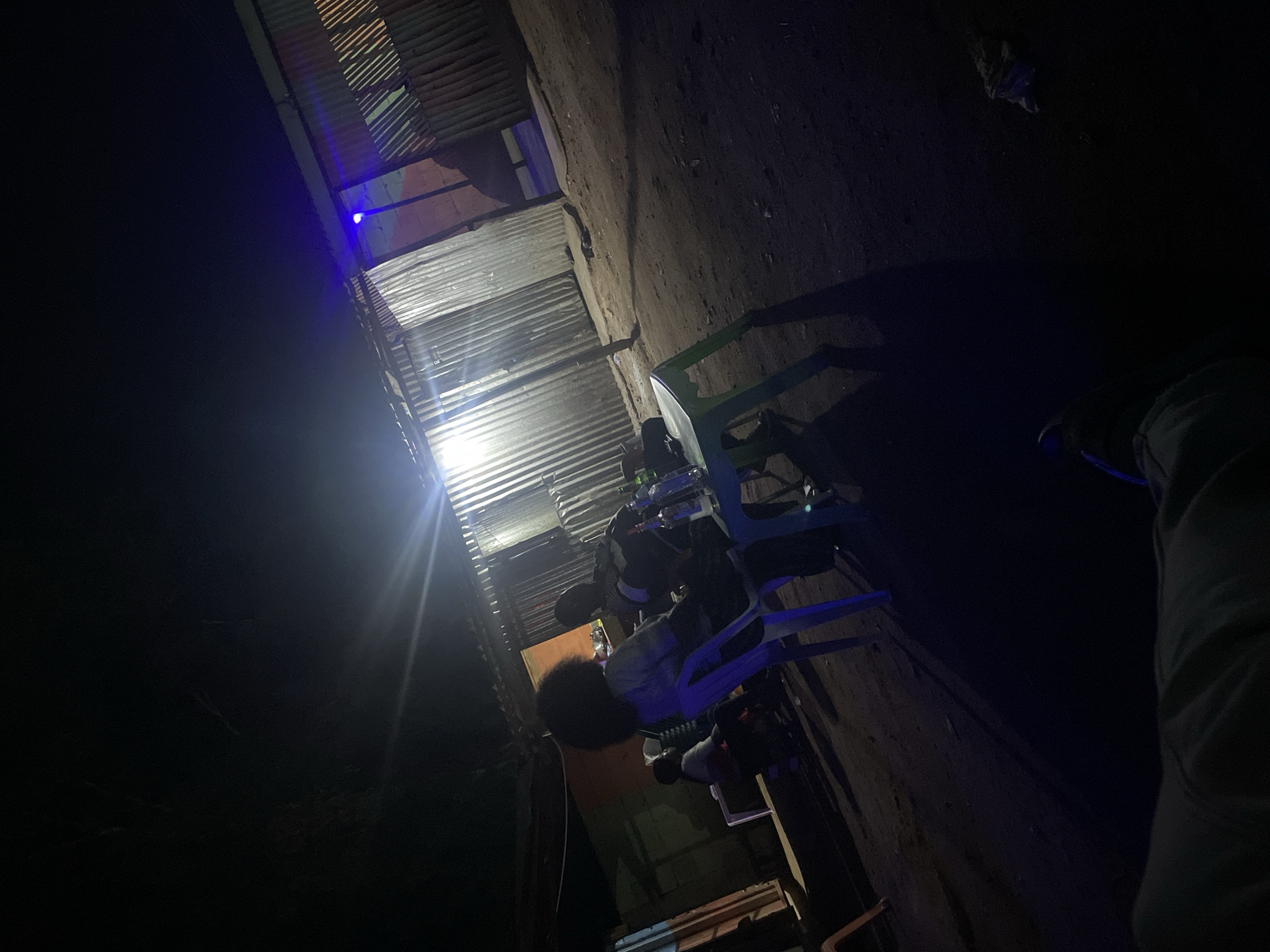 Two people photographed in casual indoor settings in Jos