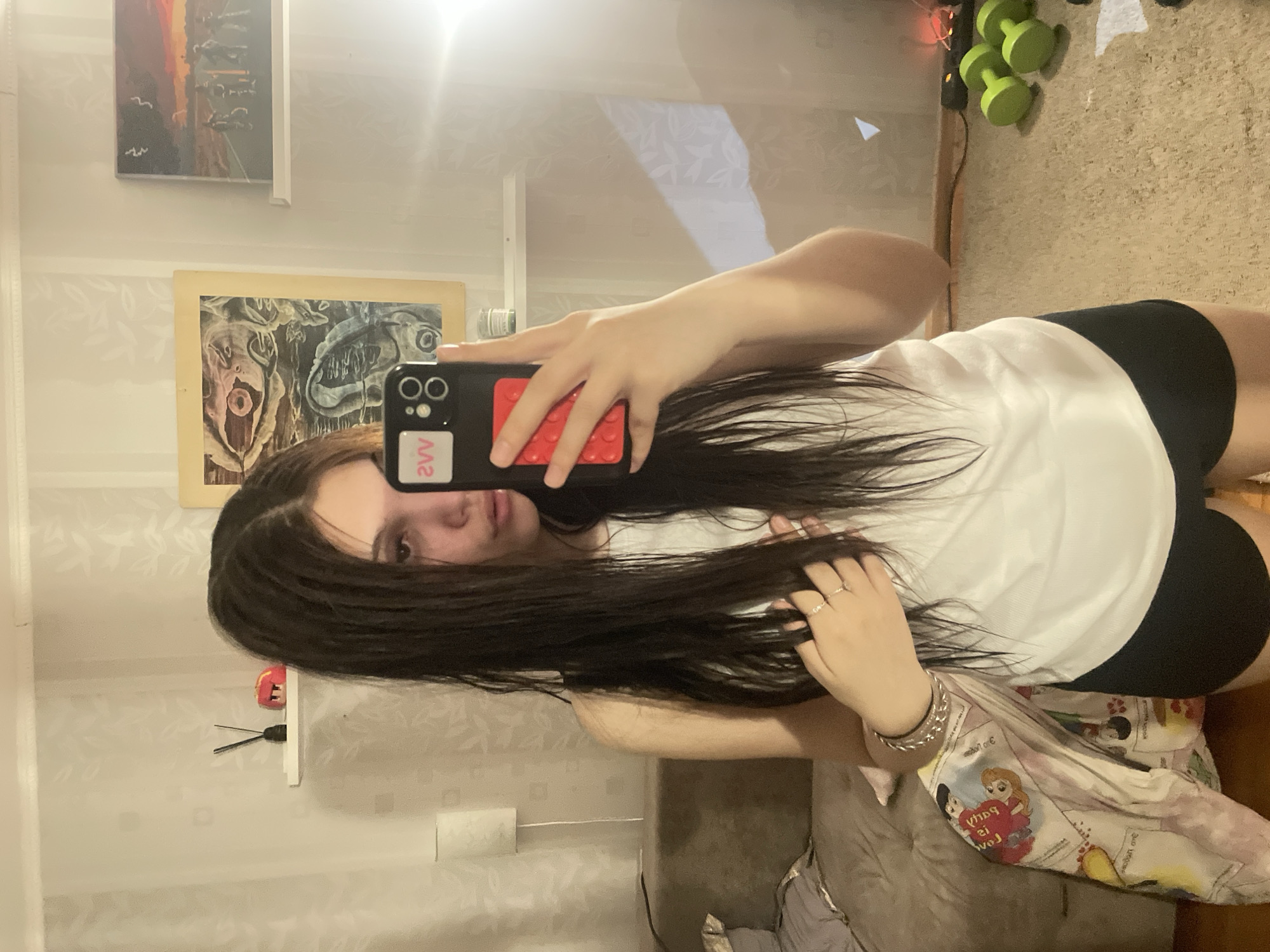 Woman takes mirror selfie indoors in Saint Petersburg
