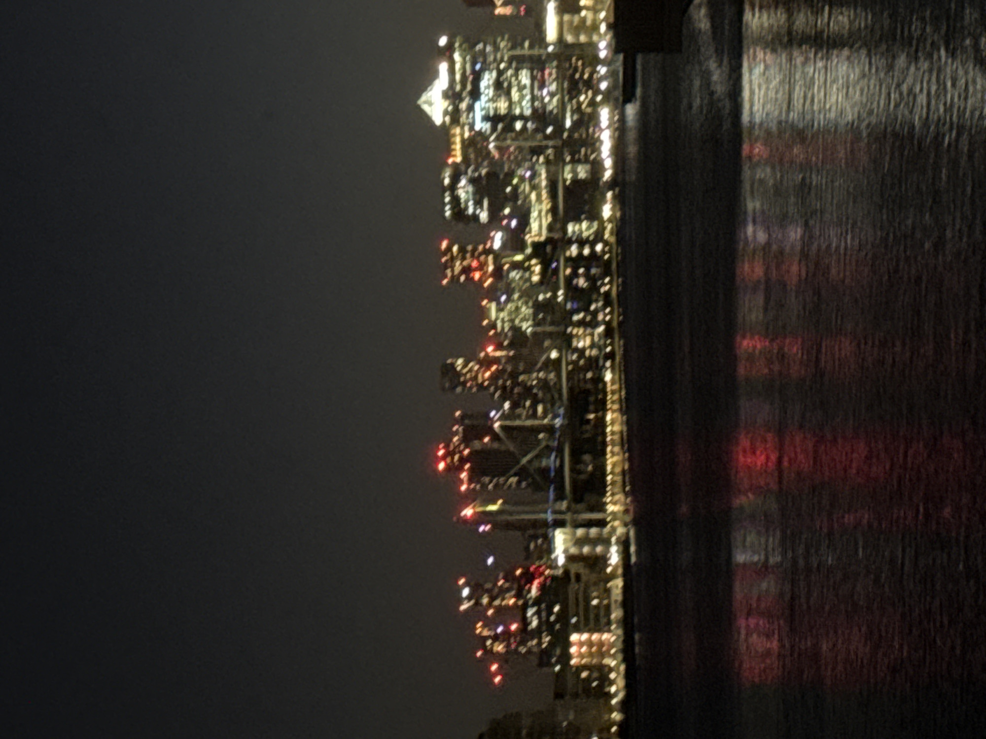 London skyline lights reflect on water during night hours