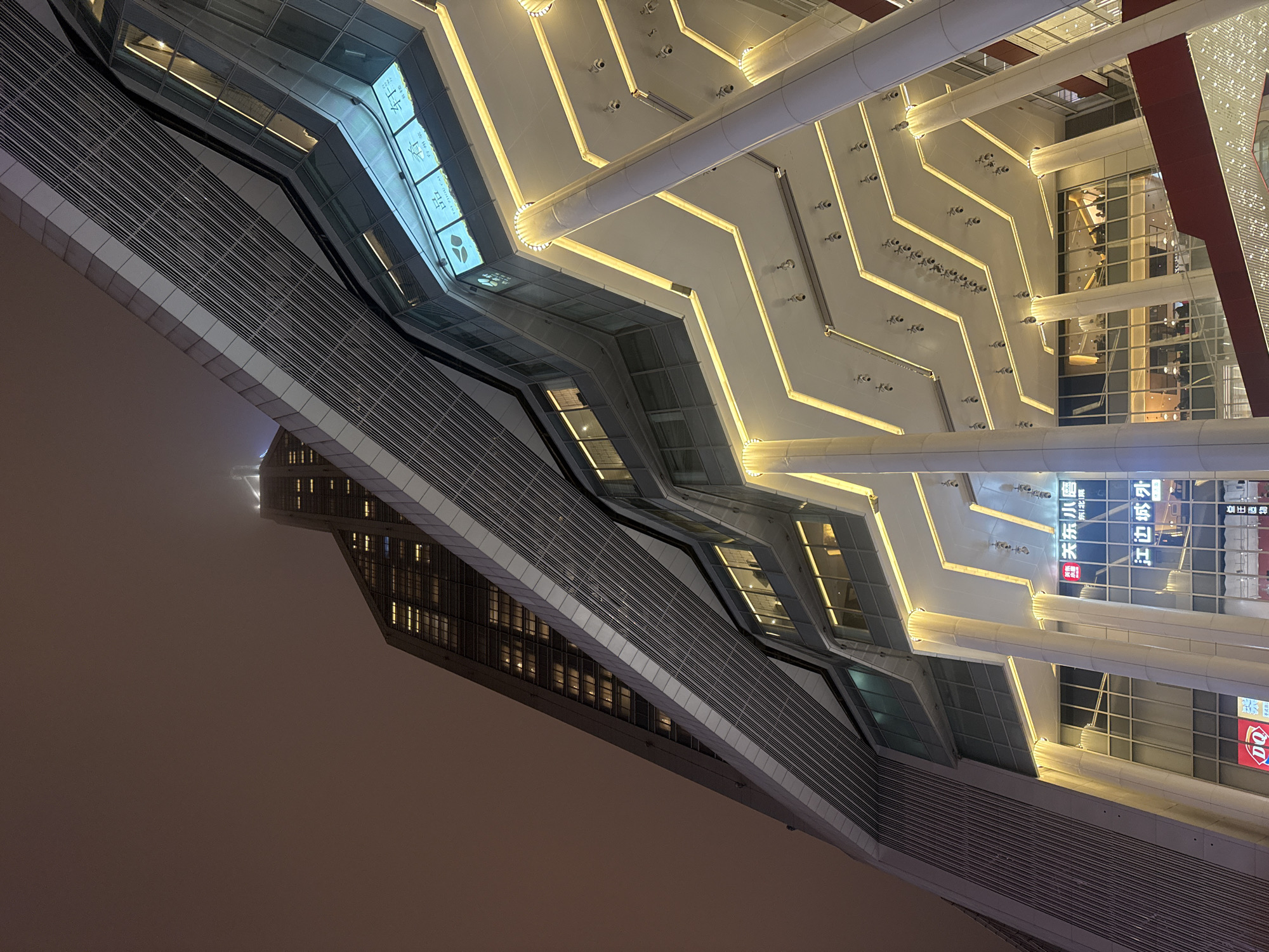 Modern glass building with zigzag design photographed in Shanghai