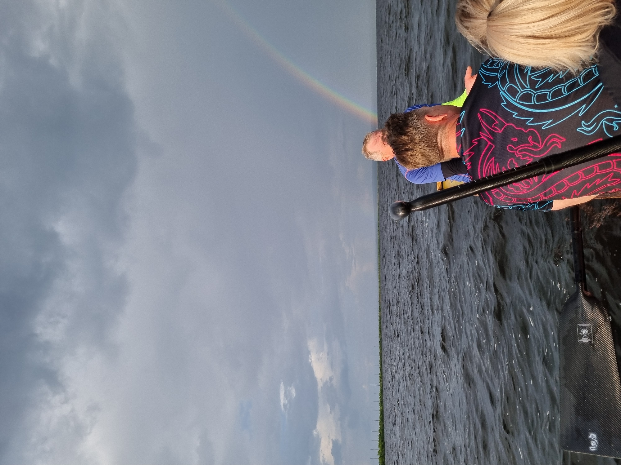 Boat ride on a Russian river under a rainbow sky