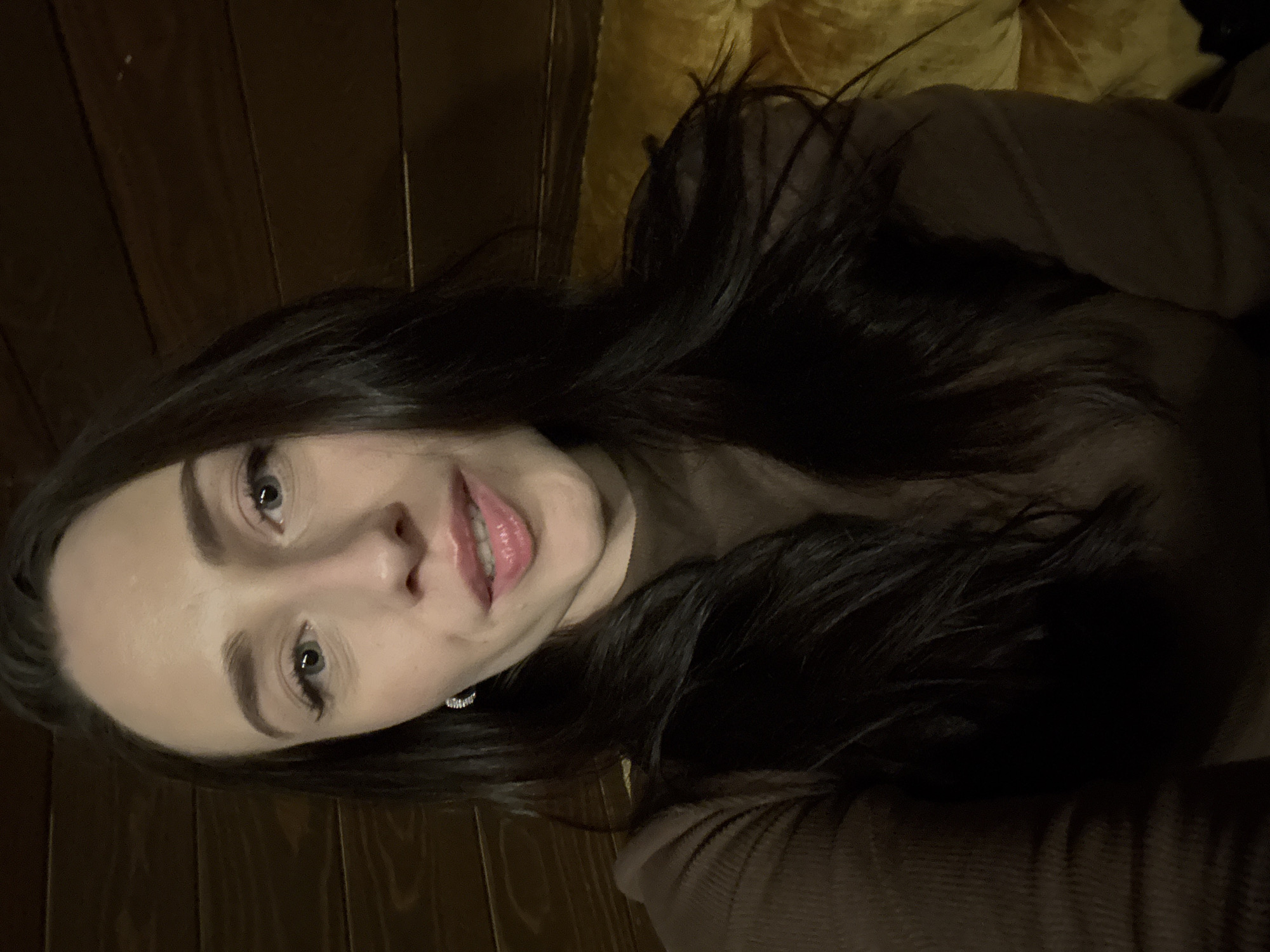 Woman in brown top observed indoors in Saint Petersburg