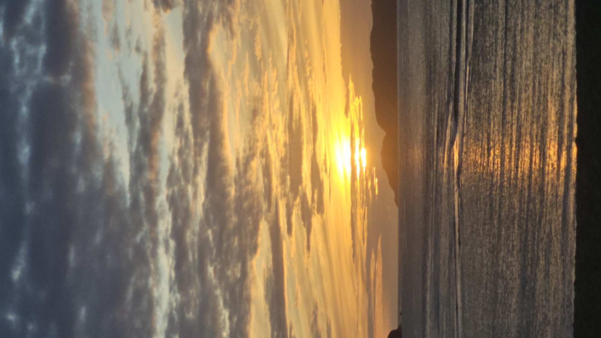 Sunset over the Barents Sea, framed by Teriberka's wooden huts