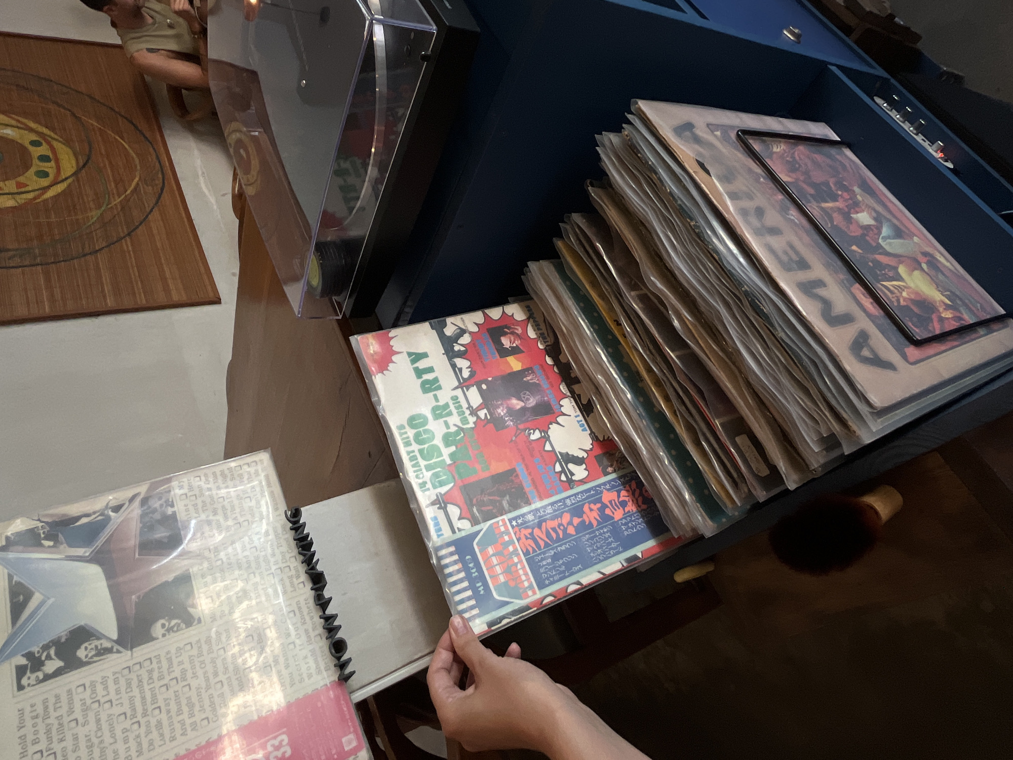 Vinyl record browsing session captured in Mengwi, Indonesia