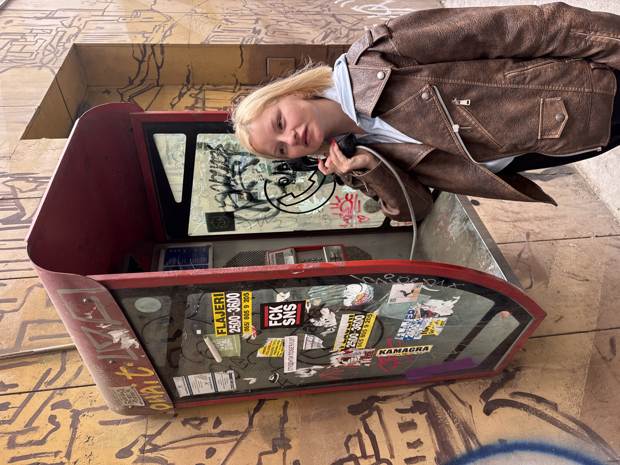 Woman Uses Red Phone Booth in Belgrade