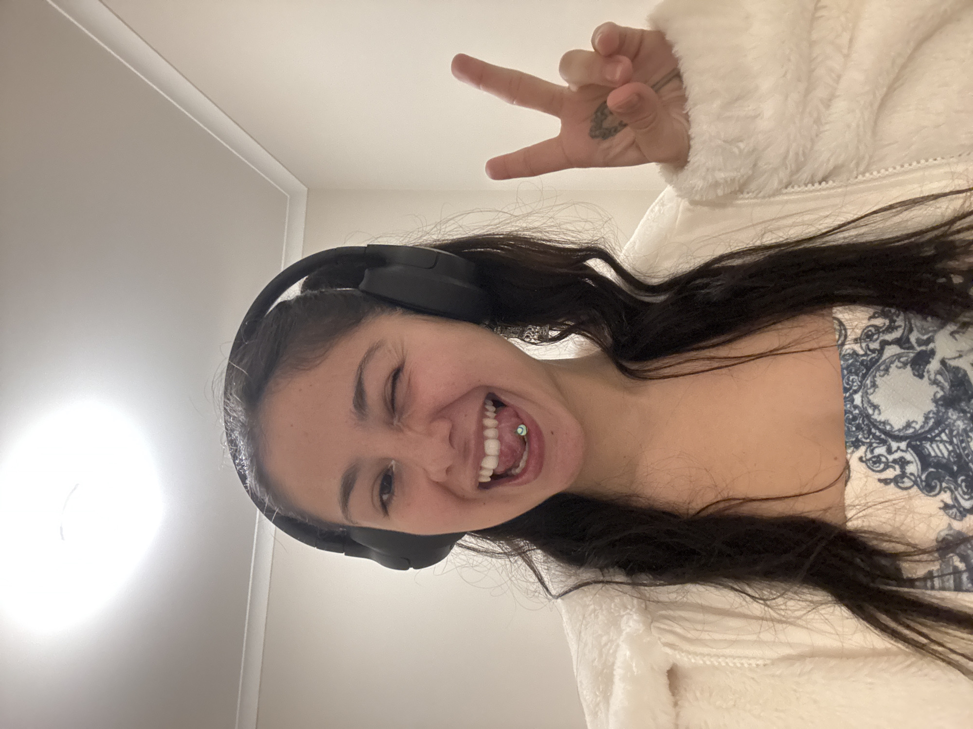 Woman takes playful selfies indoors in Como, Australia