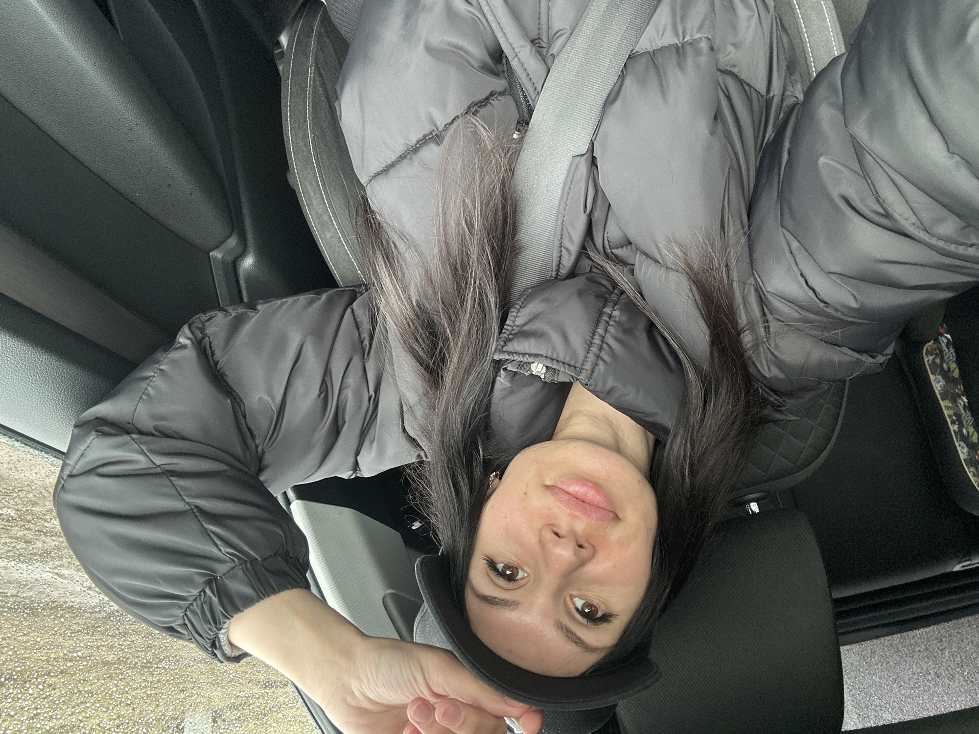 Woman in black jacket observed in car, Russia