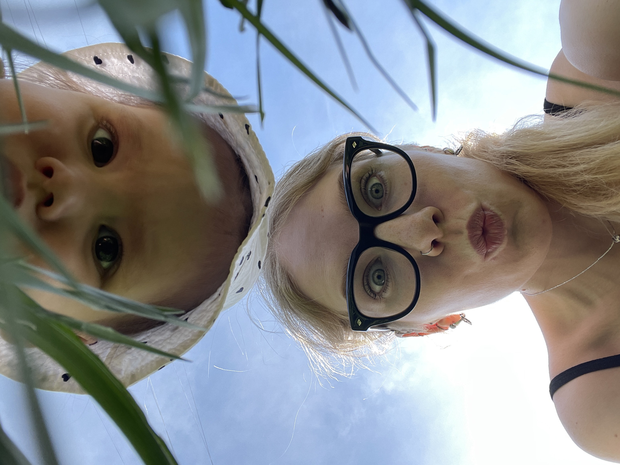 Mother and baby gather dandelions in Izhevsk spring morning