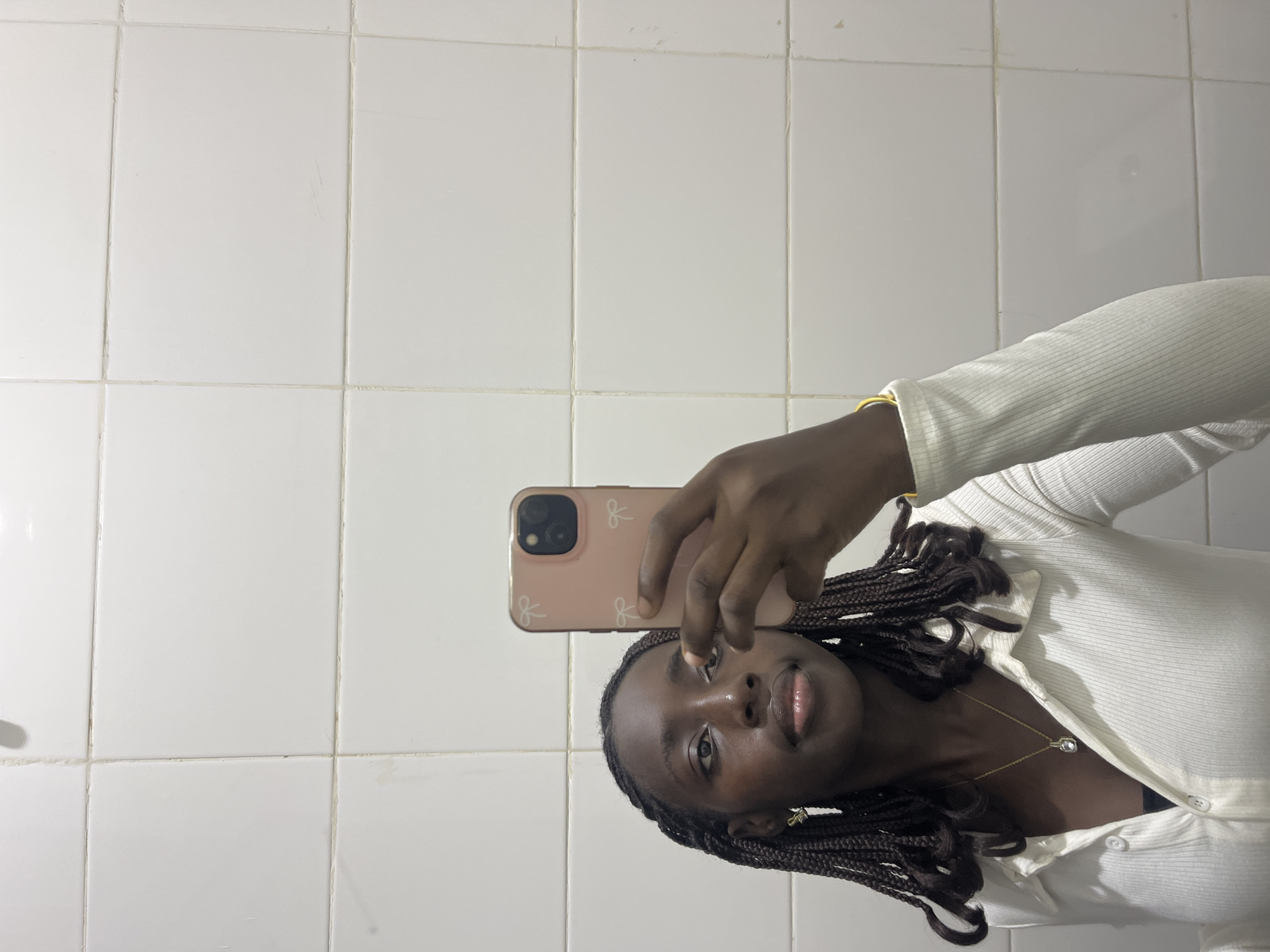 Young woman takes mirror selfies across multiple Karum locations