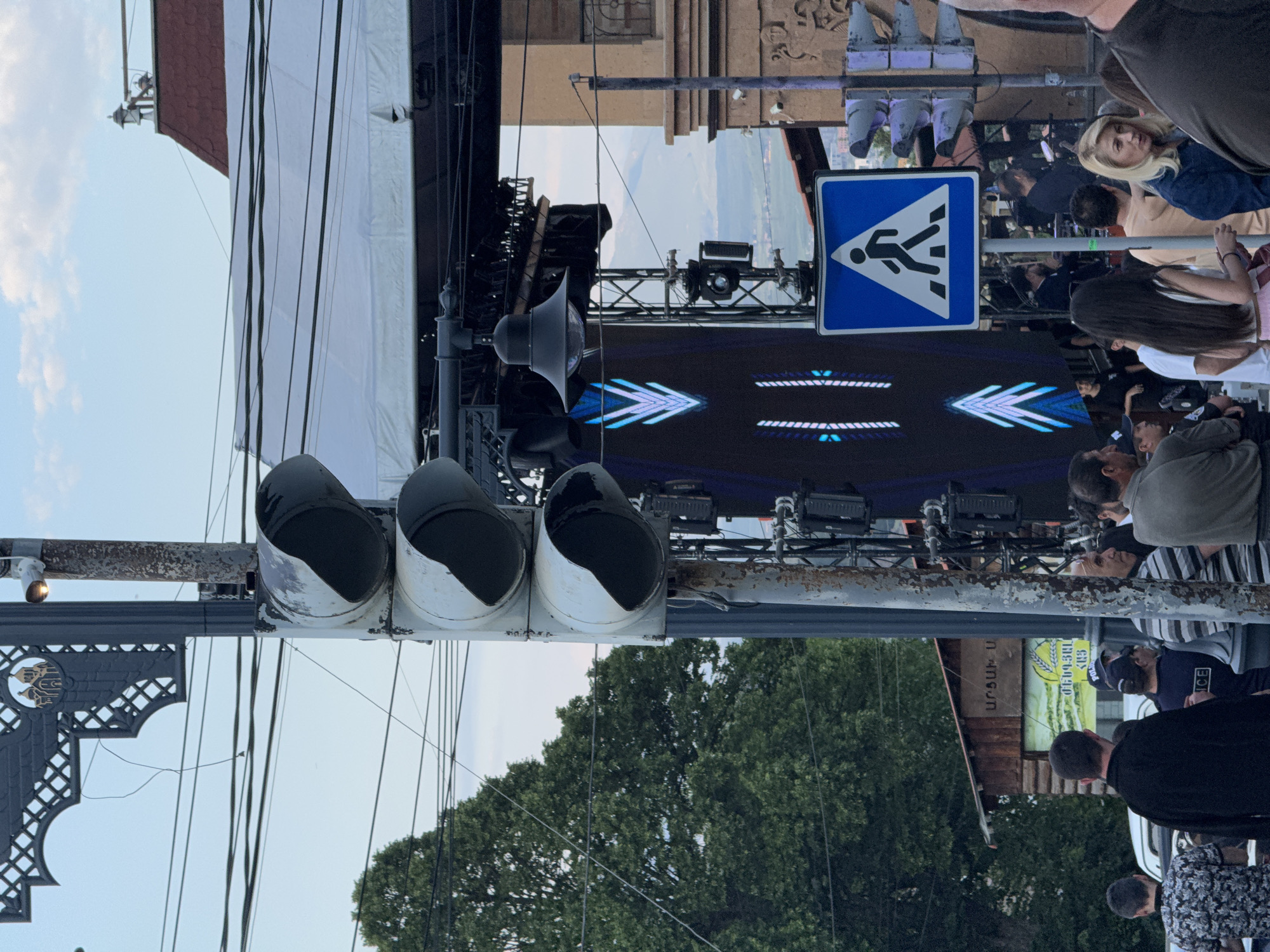 Street scenes and an outdoor DJ setup on a July afternoon