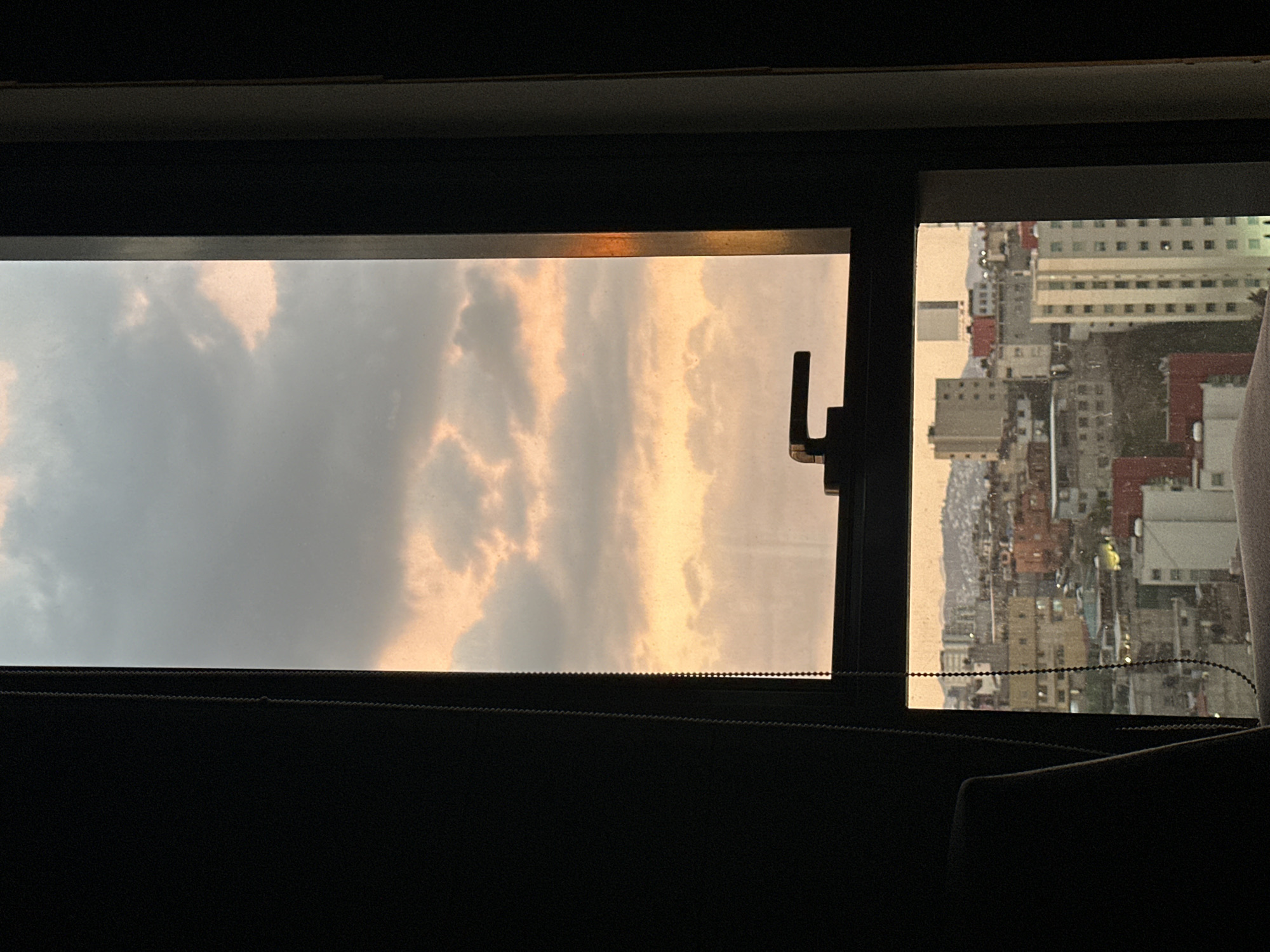 Golden clouds observed through window in Huixquilucan, Mexico