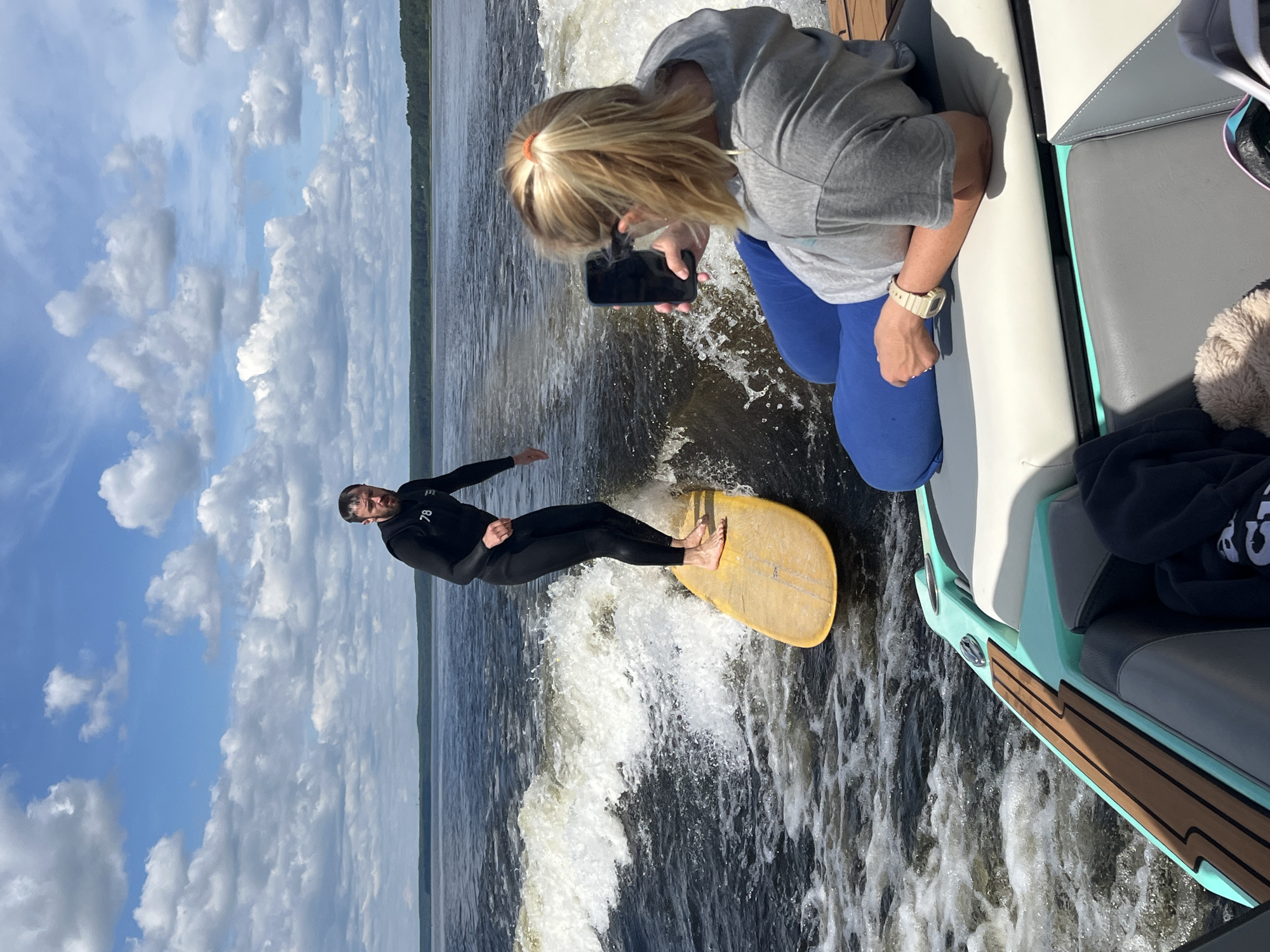 Boating and wakeboarding on a Russian lake in summer