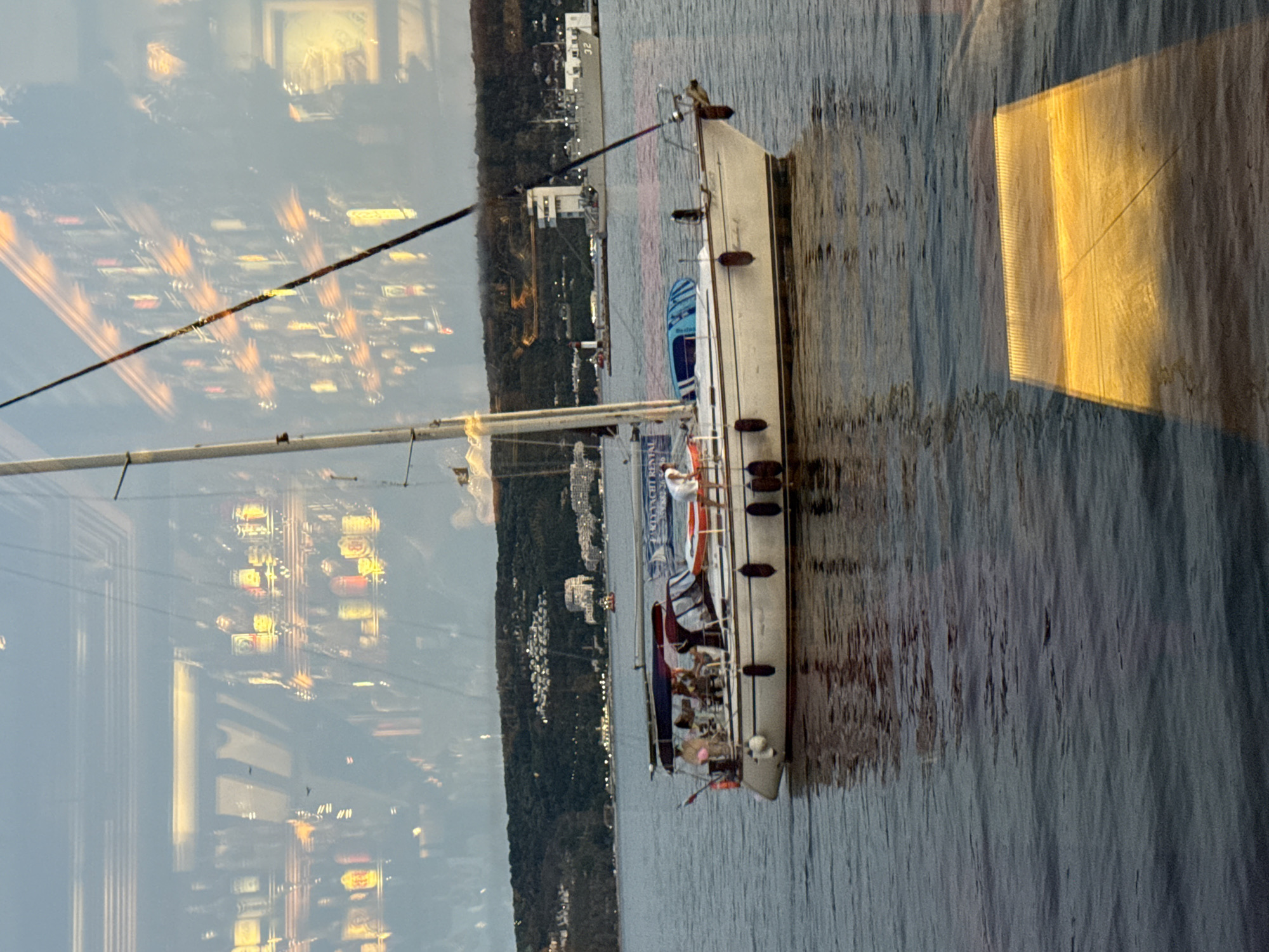 Sailboat moored off the Varna coastline with city backdrop